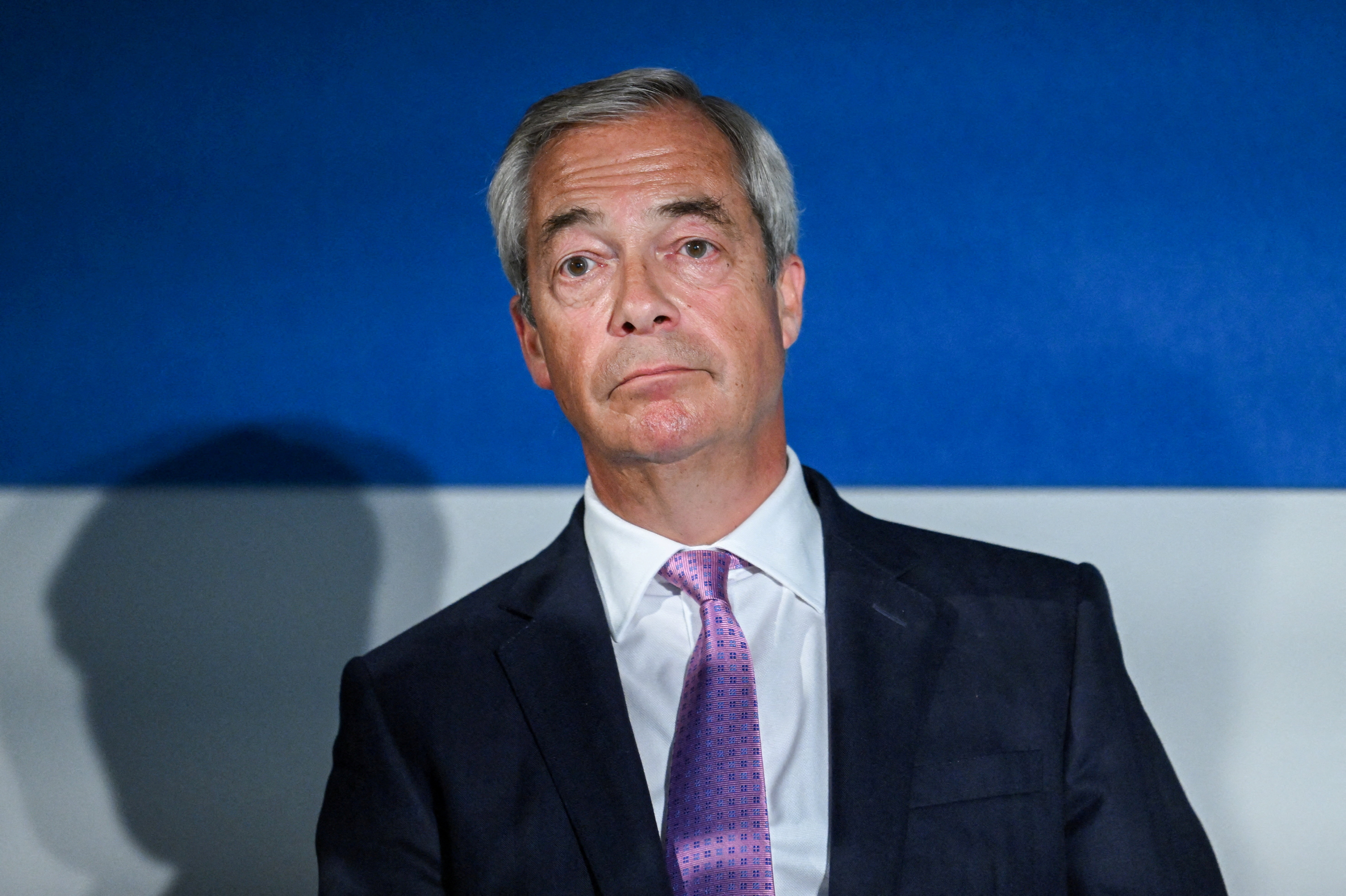 UK's Farage unveils plan to deport asylum seekers, warns of 'civil  disorder' | Reuters