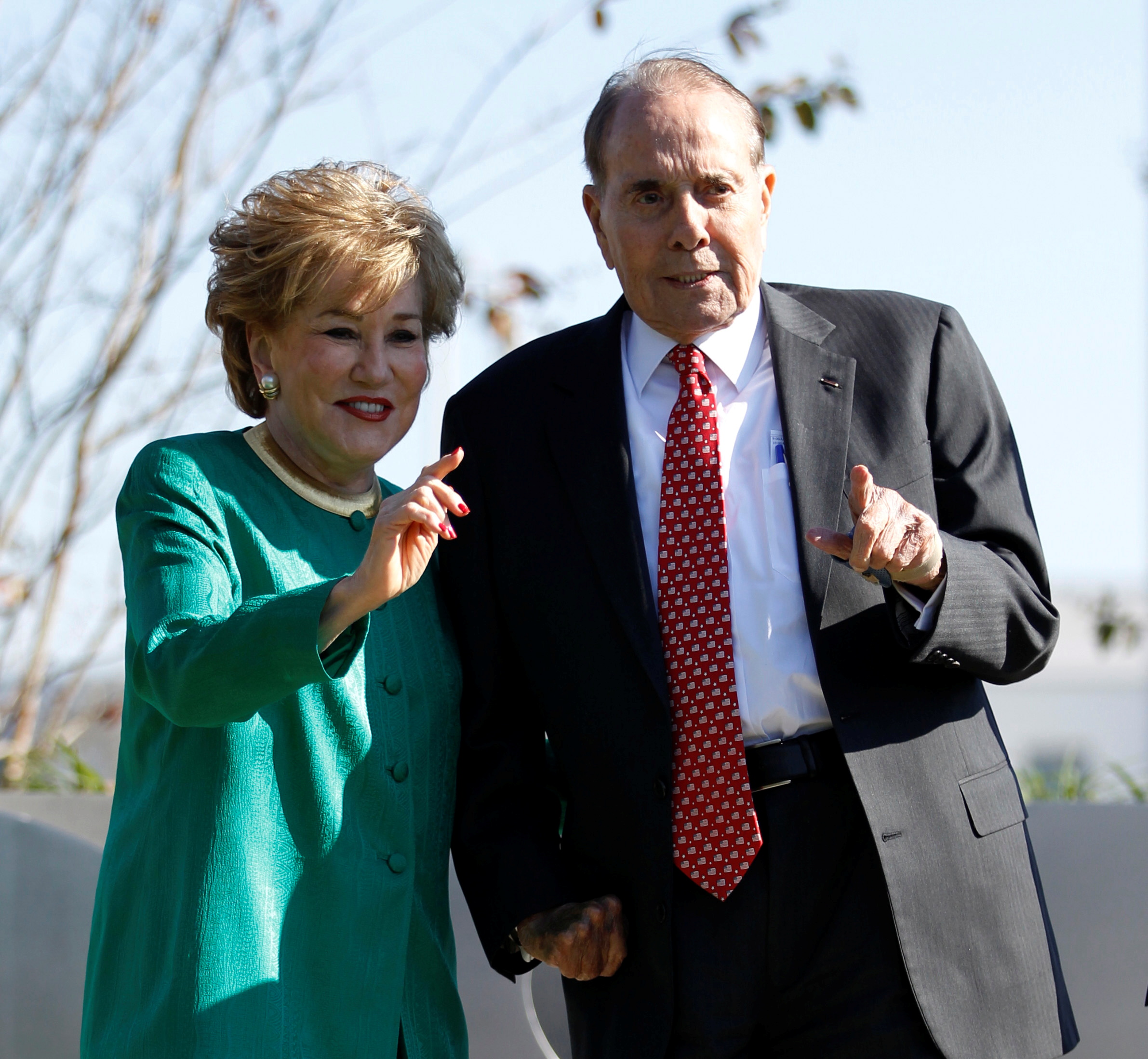 Former U.S. Secretary of Transportation Elizabeth Dole and her husband, former Senator Bob Dole, are pictured at the unveiling of a statue of former U.S. President Ronald Reagan at Ronald Reagan National Airport near Washington