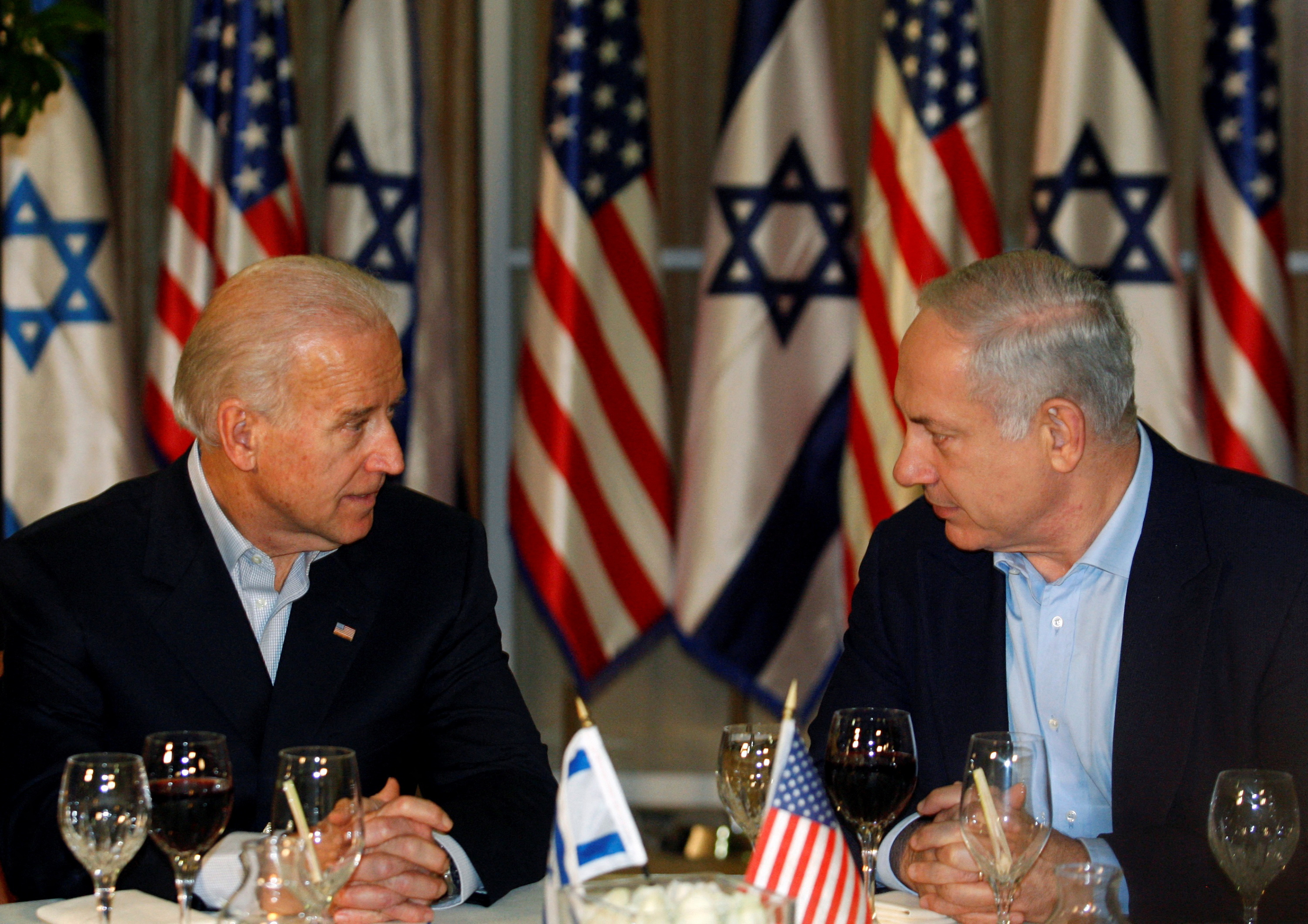 U.S. Vice President Joe Biden sits with Israel's Prime Minister Benjamin Netanyahu before a dinner in Jerusalem