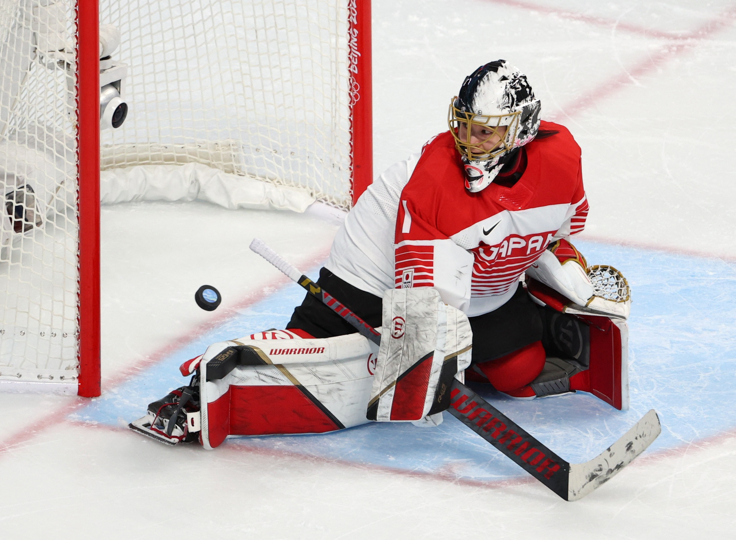 Ice hockeyChina upset rivals Japan in tense shootout, U.S. best Swiss