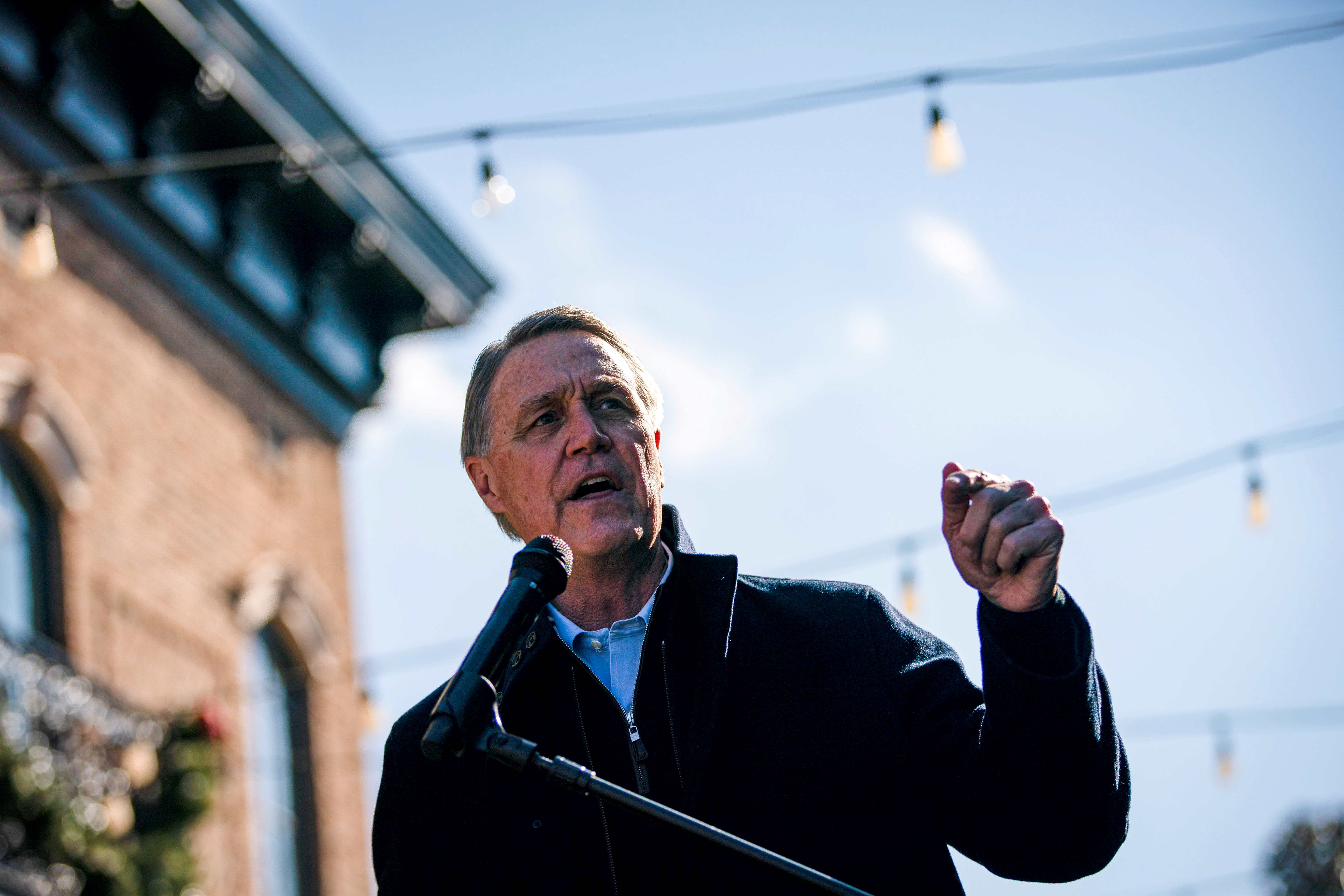 Senator David Perdue (R-GA) speaks during a campaign event as he runs for reelection at the Olde Blind Dog Irish Pub, in Milton