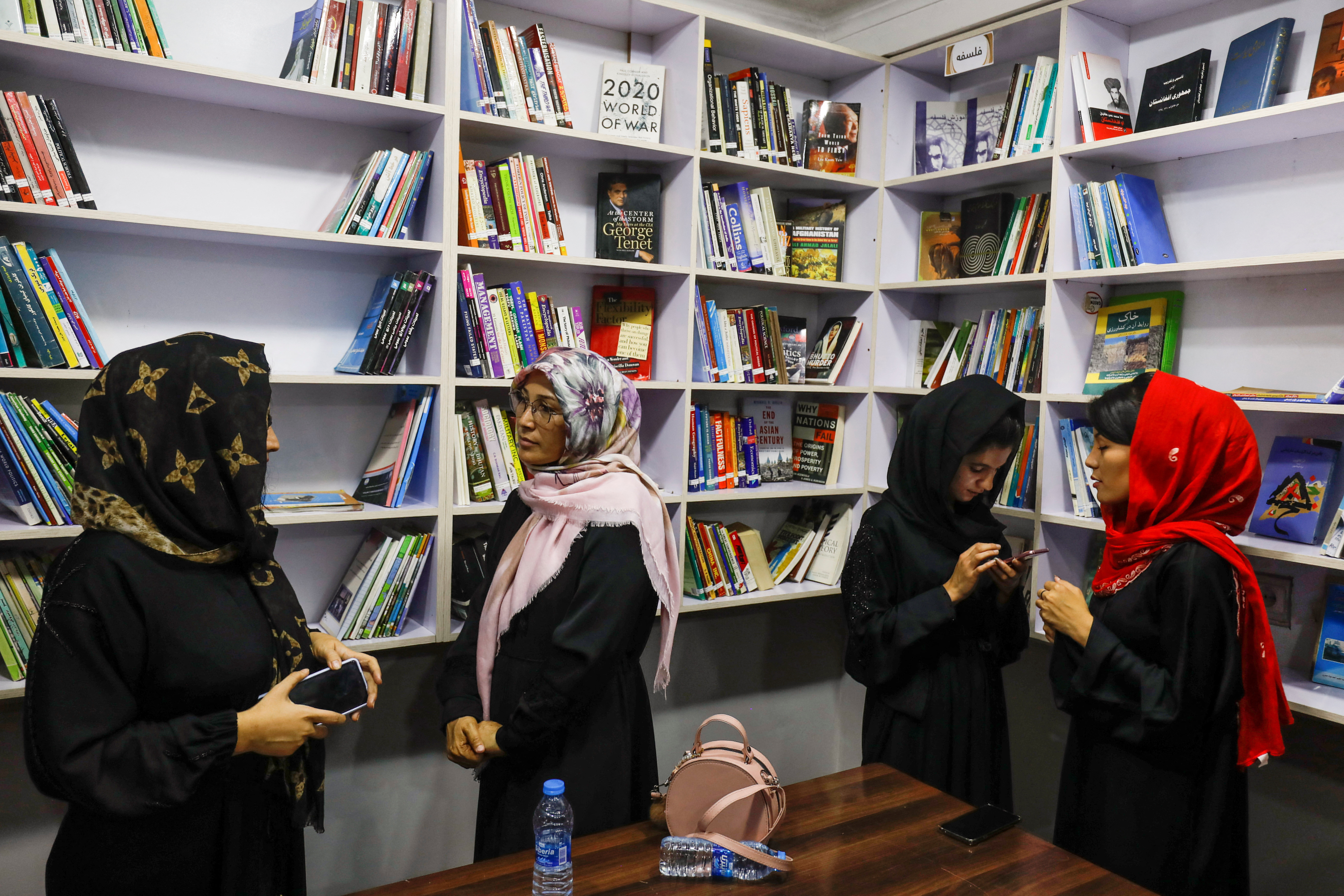 Afghan women attend the inauguration of women's library in Kabul