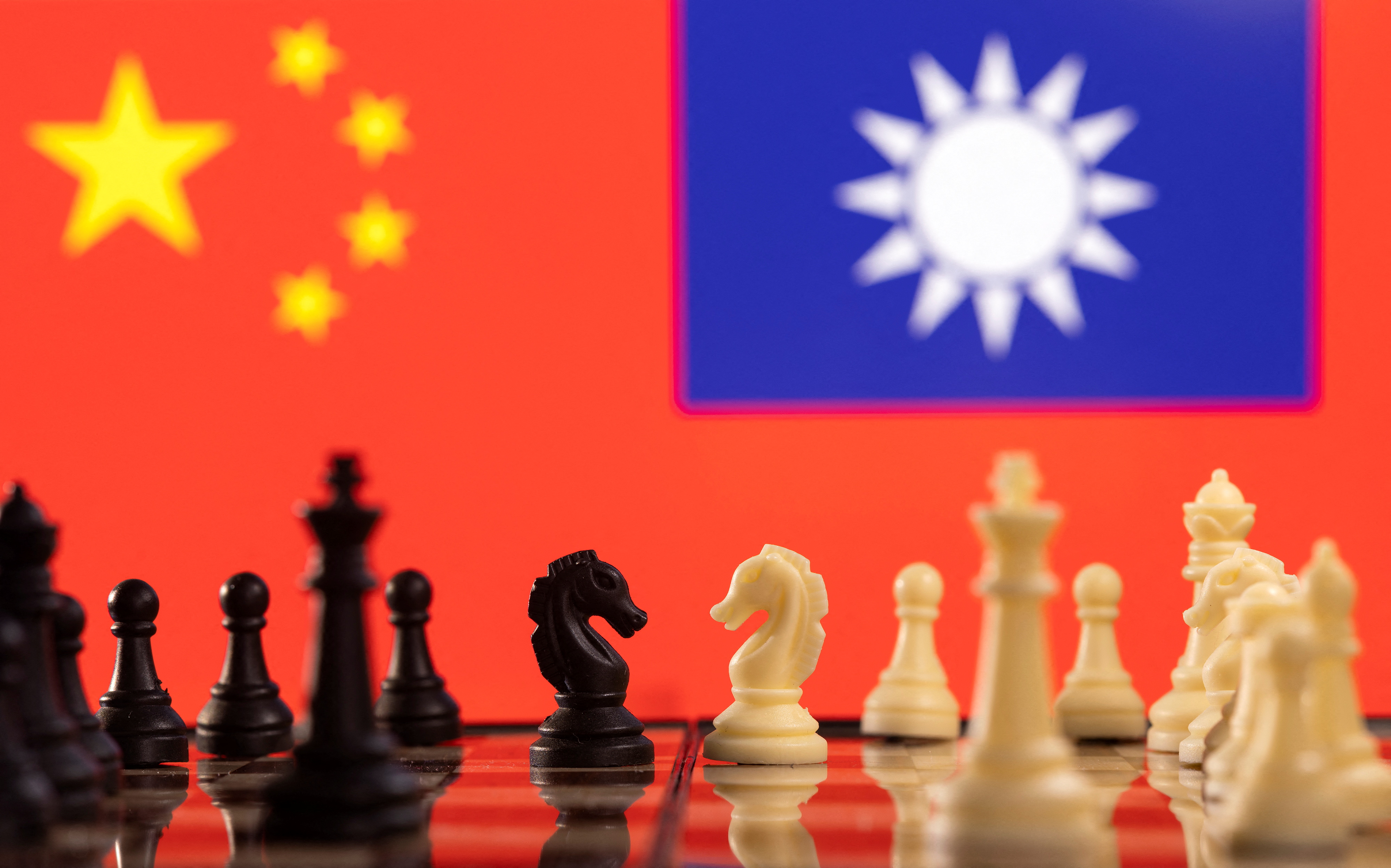 Illustration shows China and Taiwan's flags
