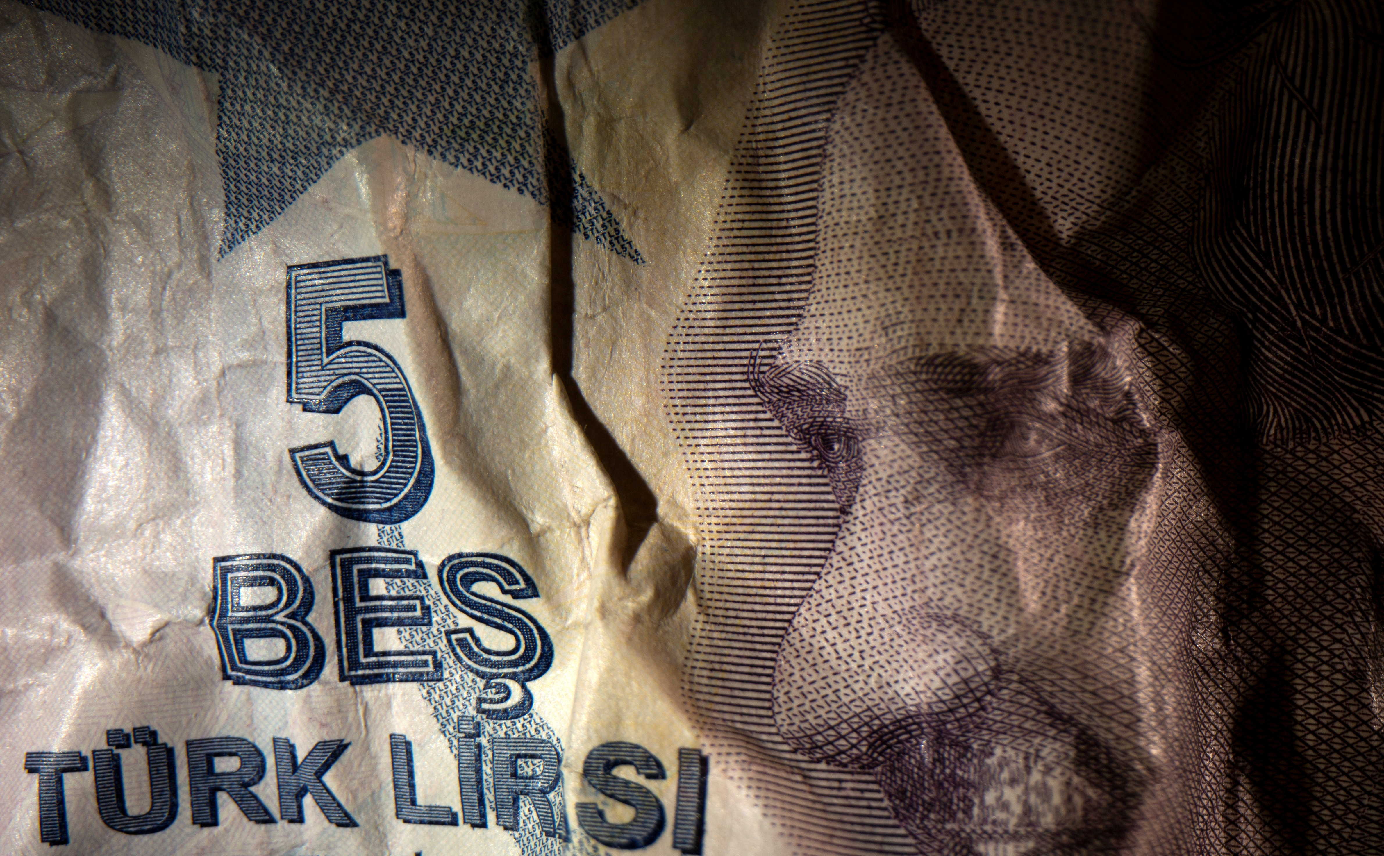 Crumpled Turkish Lira banknote is seen in this illustration