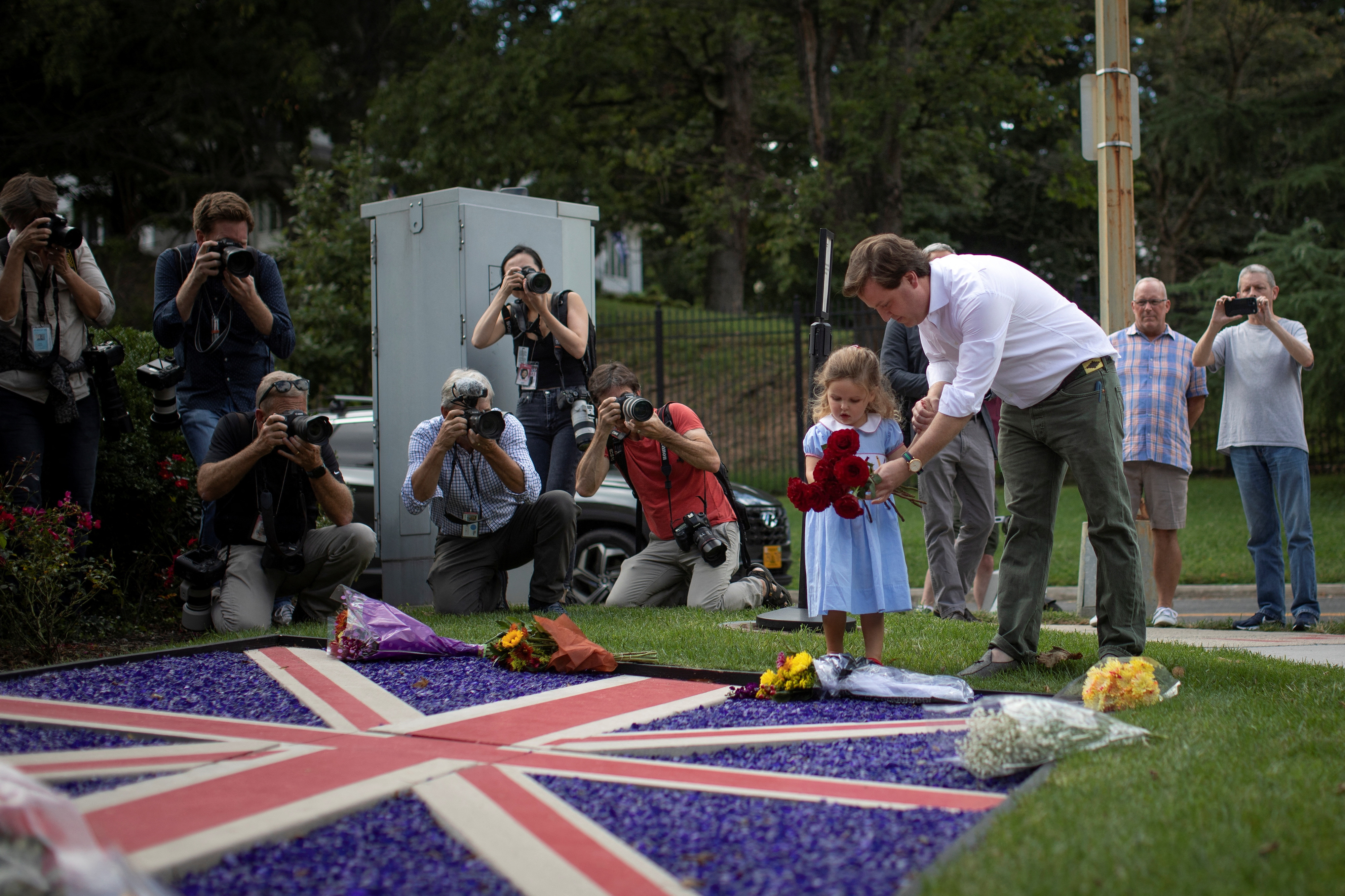 Mourners pay respects to Britain's Queen Elizabeth at the British Embassy in Washington