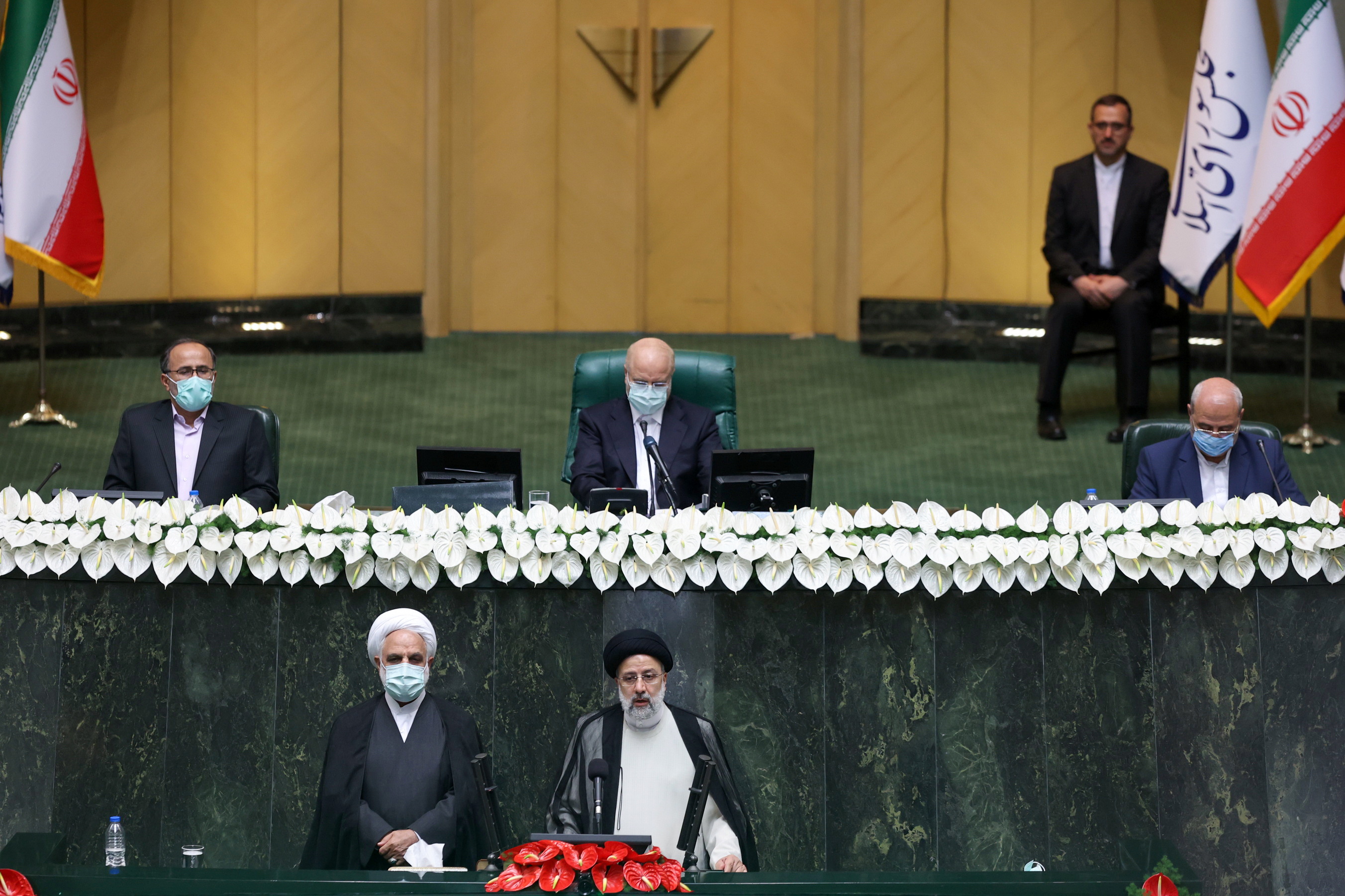 Iran's new President Ebrahim Raisi takes the oath during his swearing-in ceremony at the parliament in Tehran