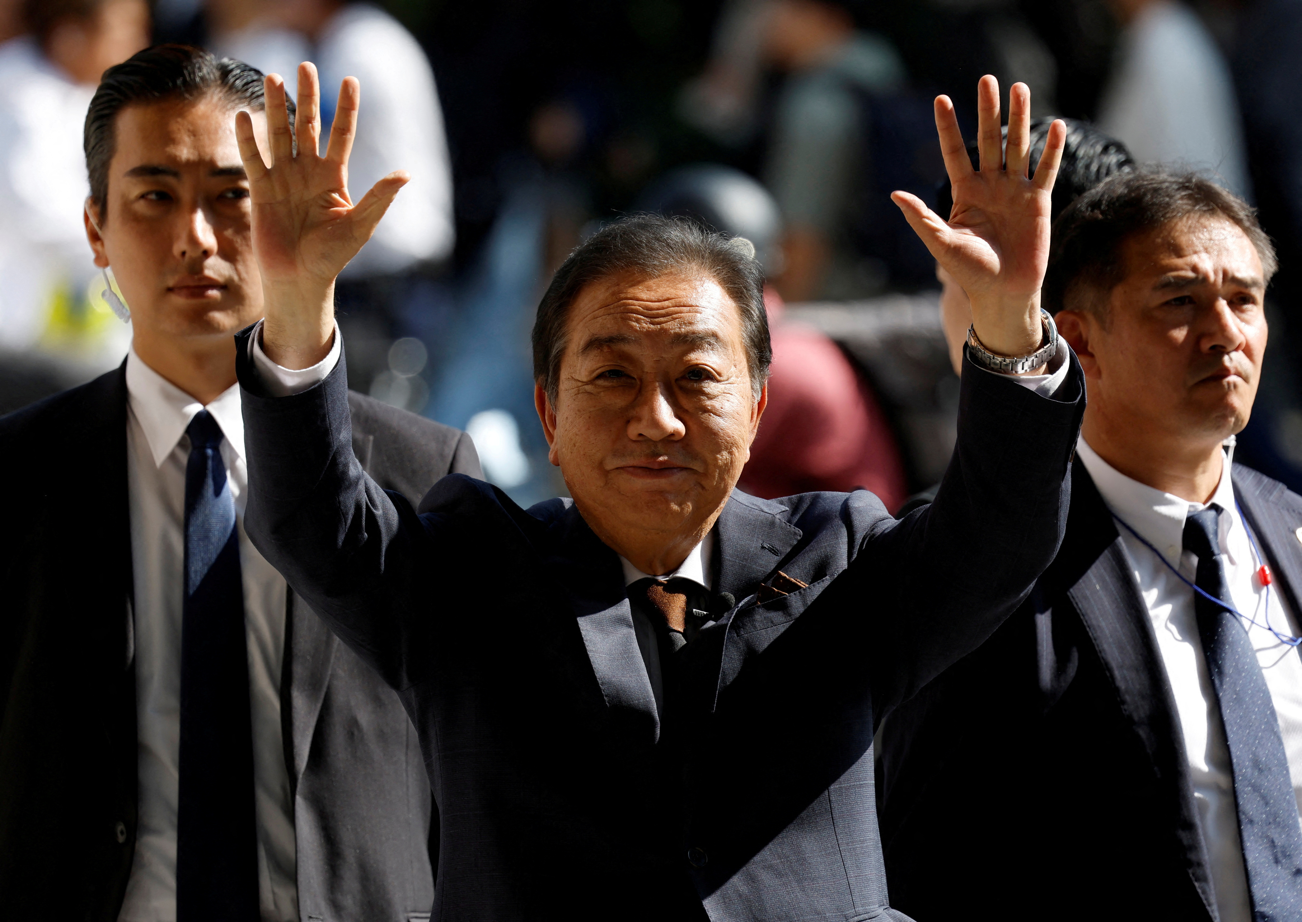 Yoshihiko Noda, leader of the main opposition Constitutional Democratic Party of Japan (CDPJ), greets locals at a campaign for the upcoming general election, in Yokohama