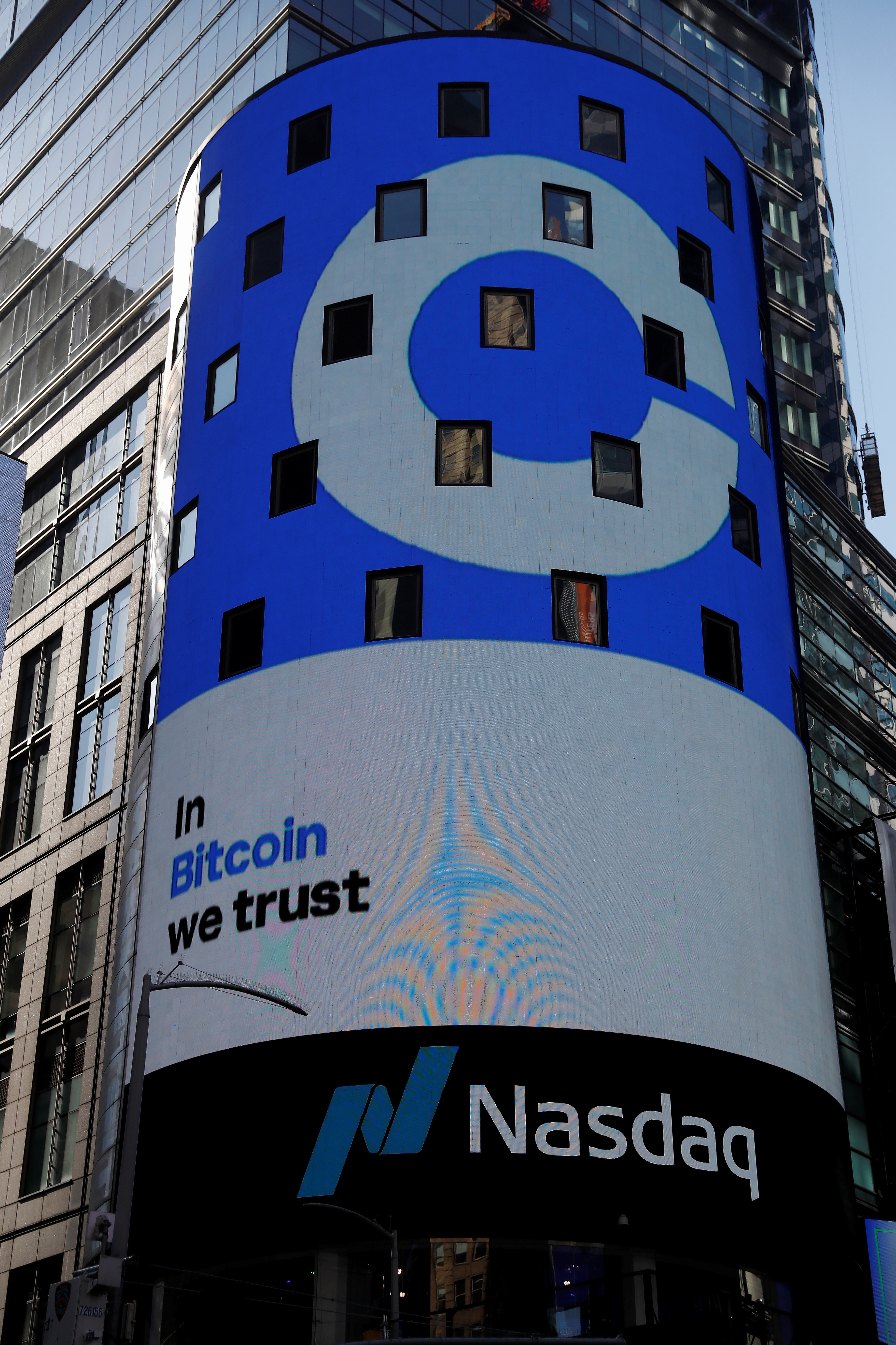 The logo for Coinbase Global Inc, the biggest U.S. cryptocurrency exchange, is displayed on the Nasdaq MarketSite jumbotron at Times Square in New York