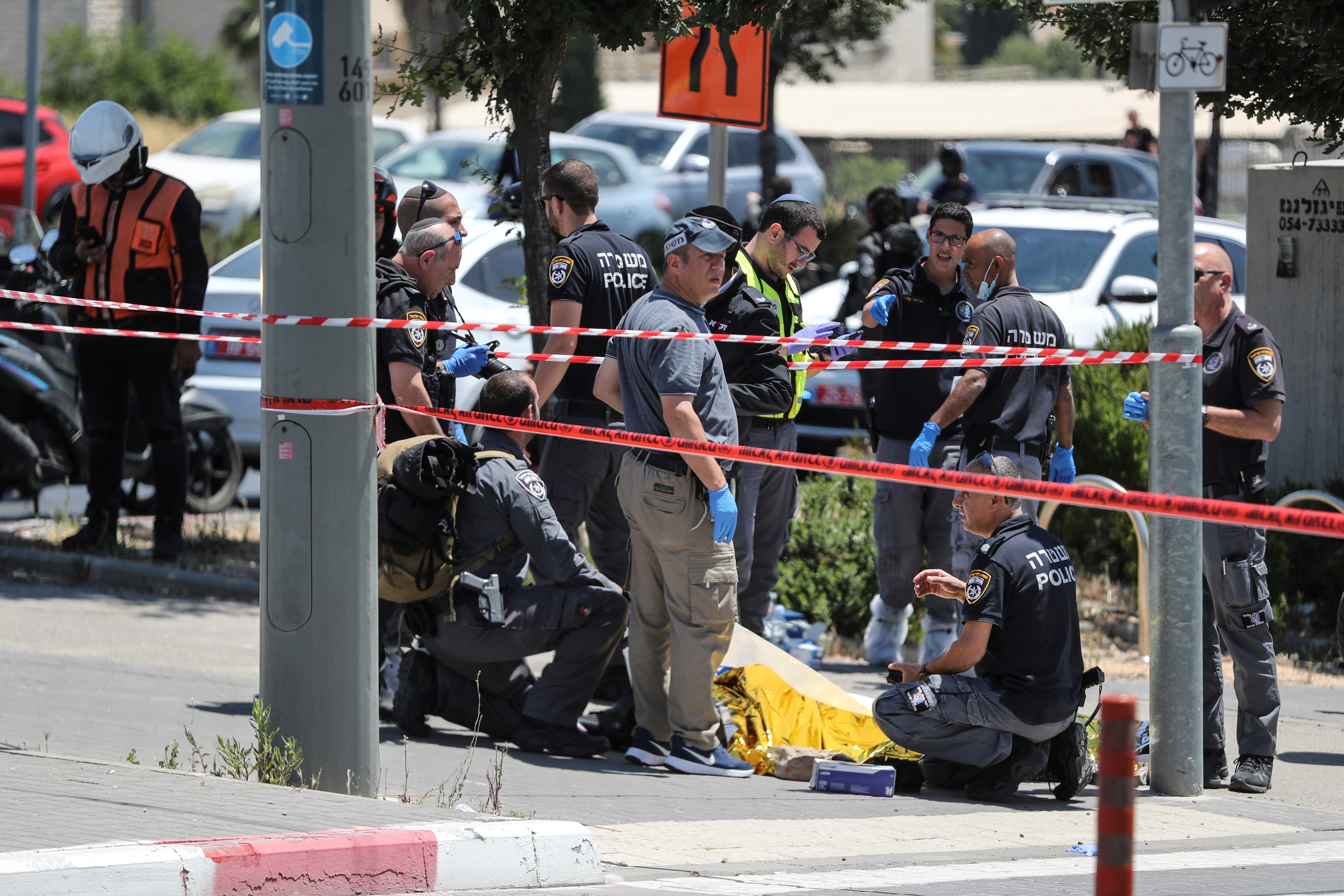 Israeli security and emergency personnel work at the scene of an incident in Jerusalem