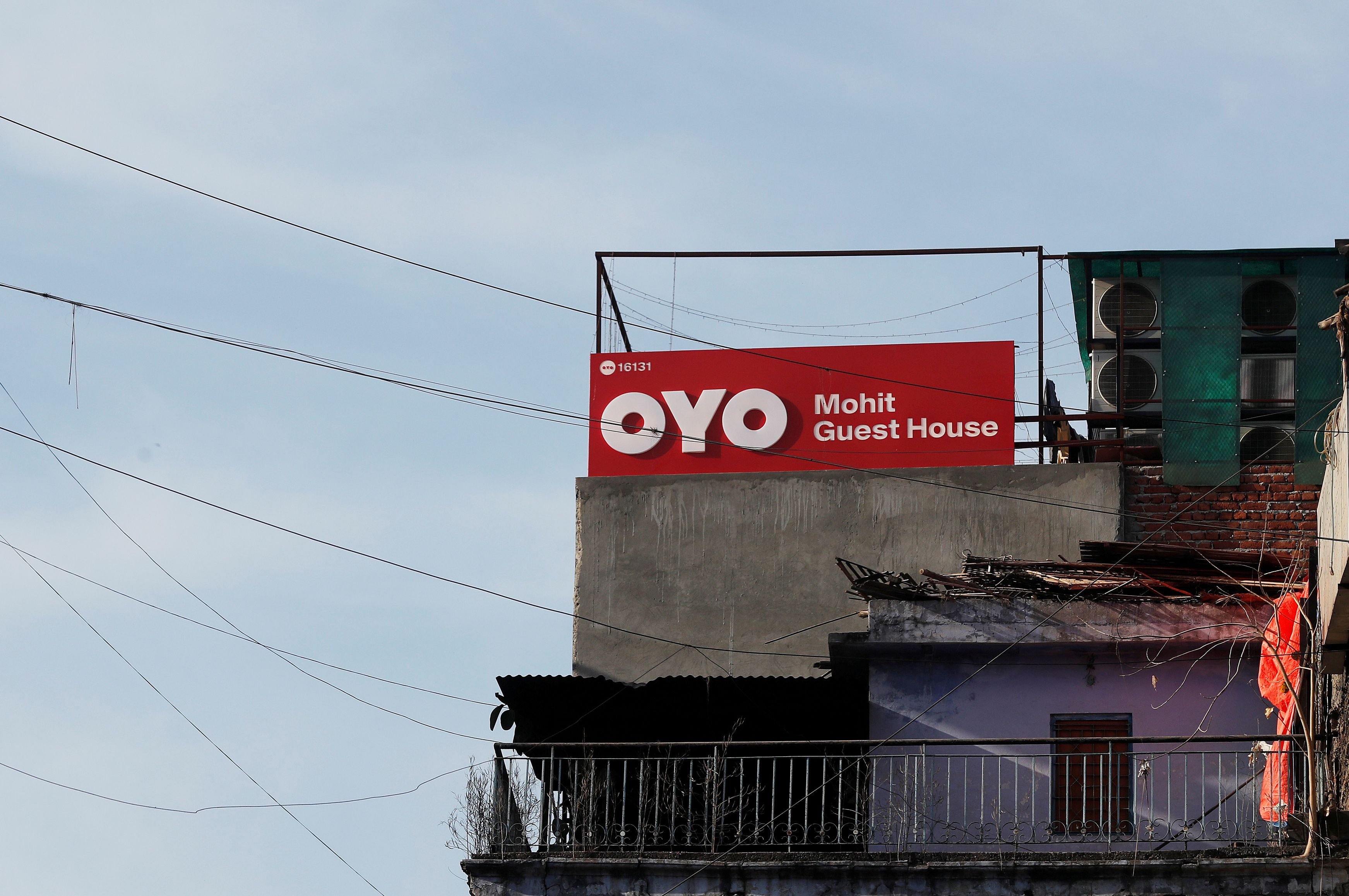 The logo of OYO, India's largest and fastest-growing hotel chain, is seen installed on a hotel building in New Delhi