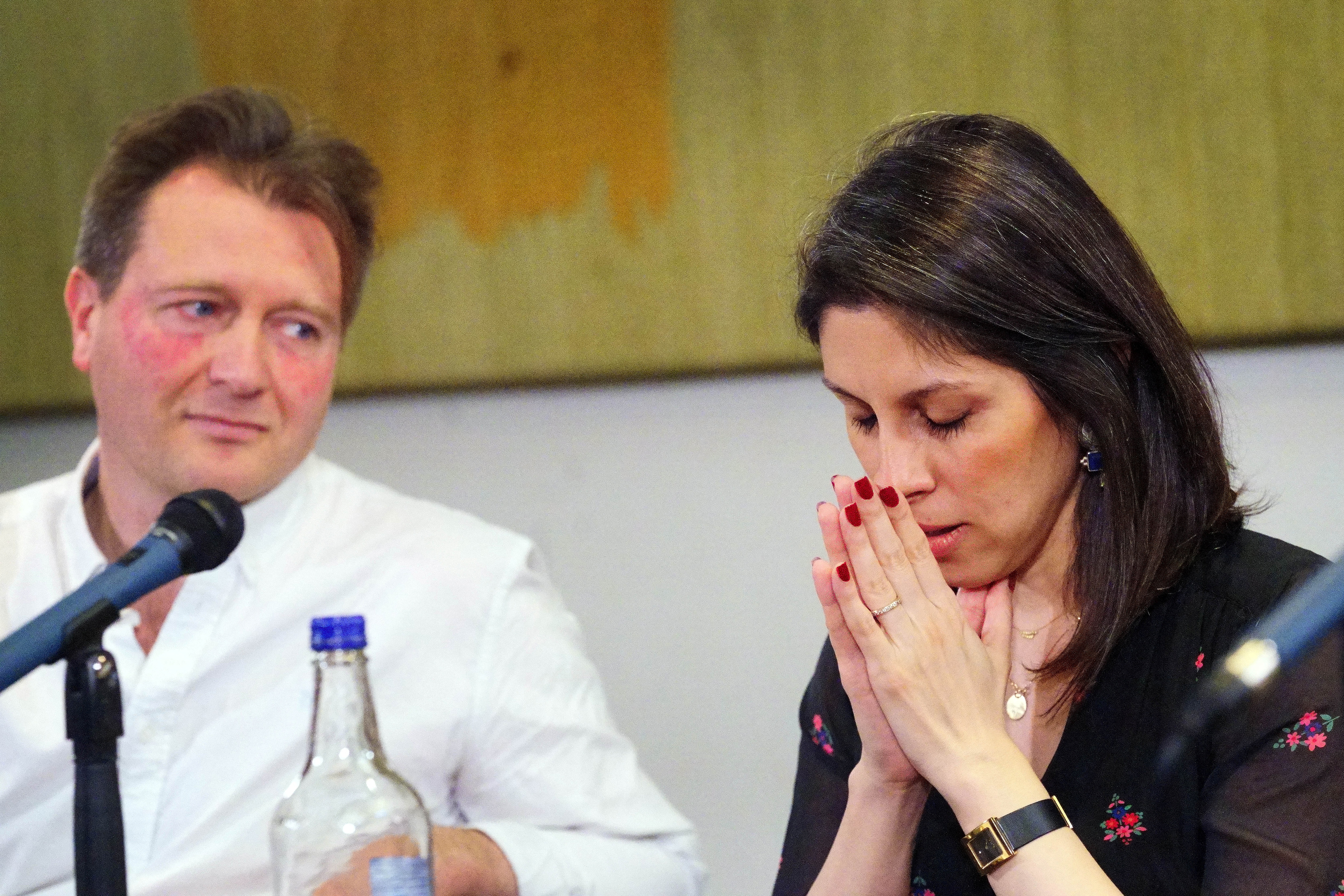 Zaghari-Ratcliffe reacts during news conference in London