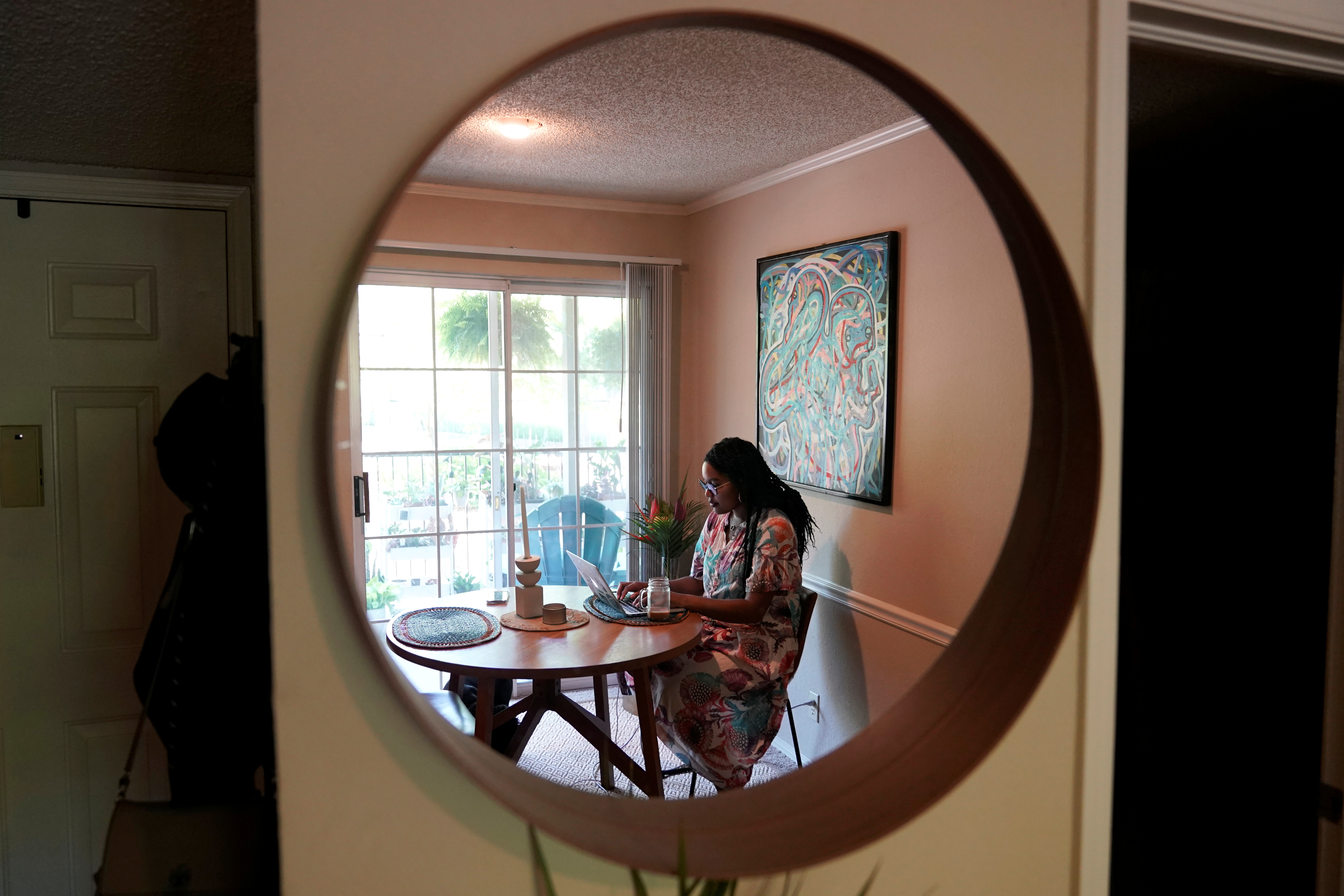 Jaleesa Garland, a marketing manager at an e-commerce startup, works in her apartment in Tulsa