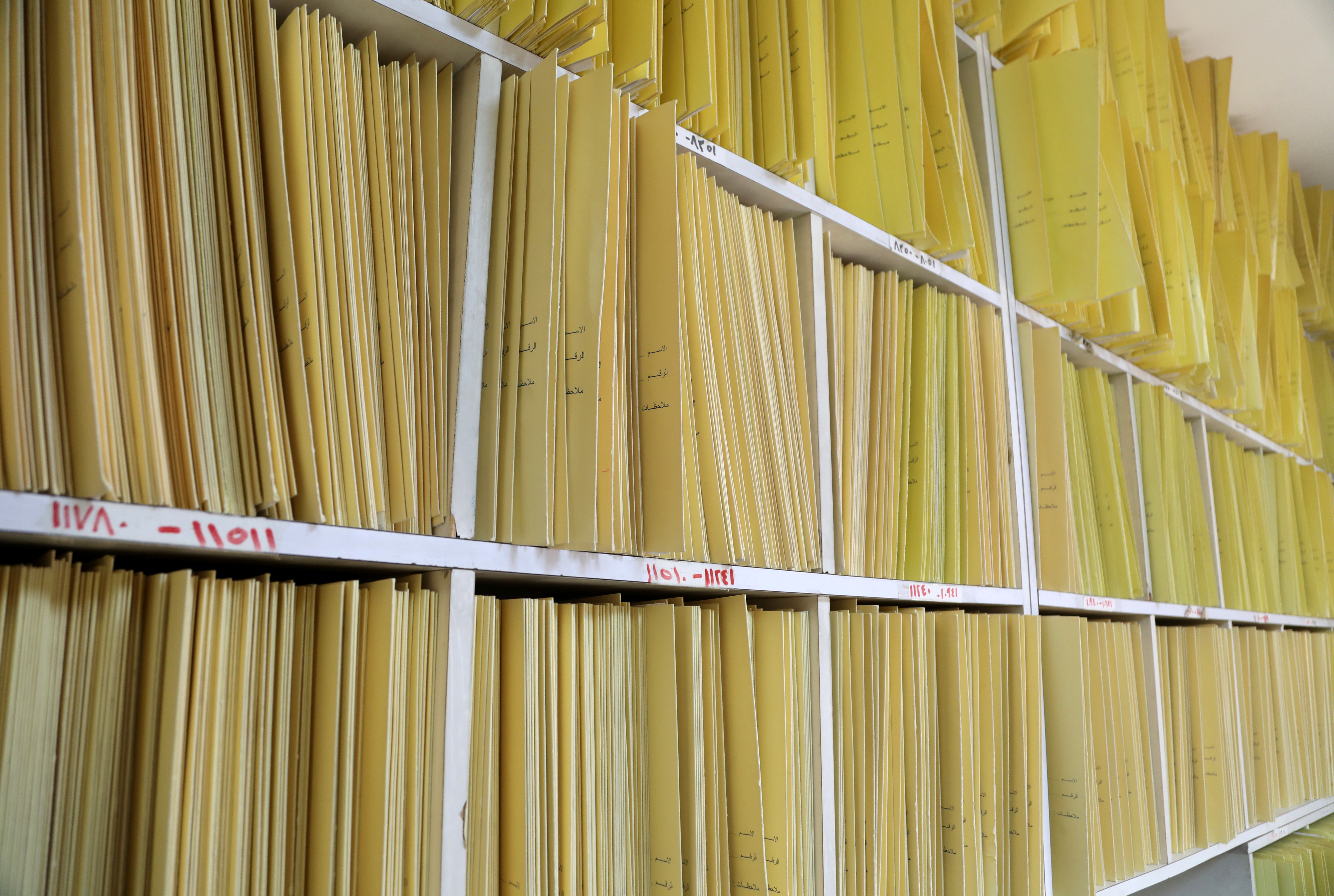 Medical records of patients are stored on shelves inside the clinic of psychiatrist, Walid Sarhan, in Amman, Jordan May 31, 2021. Picture taken May 31, 2021. REUTERS/Alaa Al Sukhni