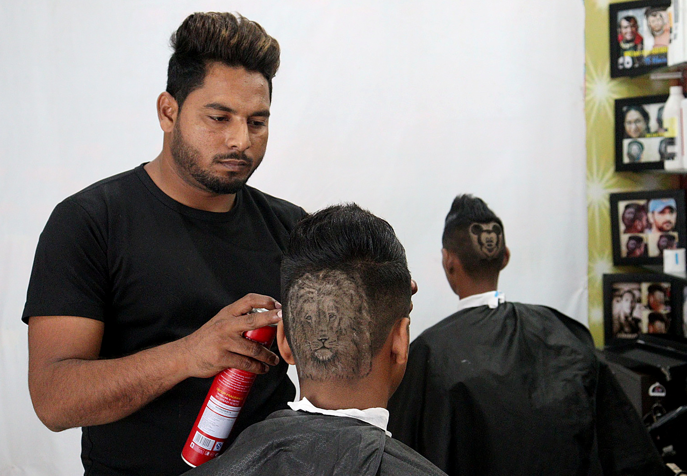 Indian barber siblings turn heads into canvasses by giving unusual haircuts  | Reuters