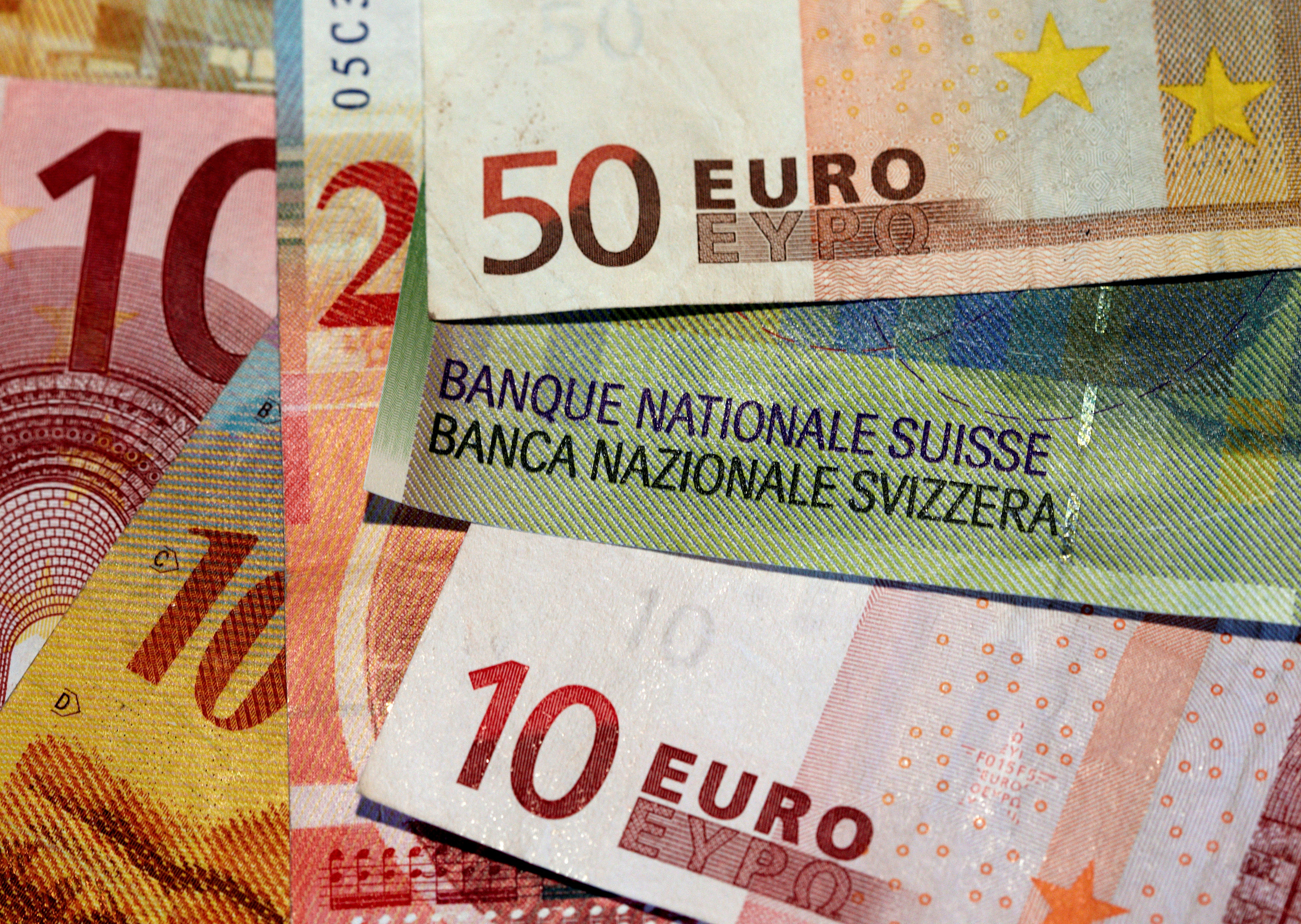 Euro and Swiss Franc notes are seen in this illustration picture