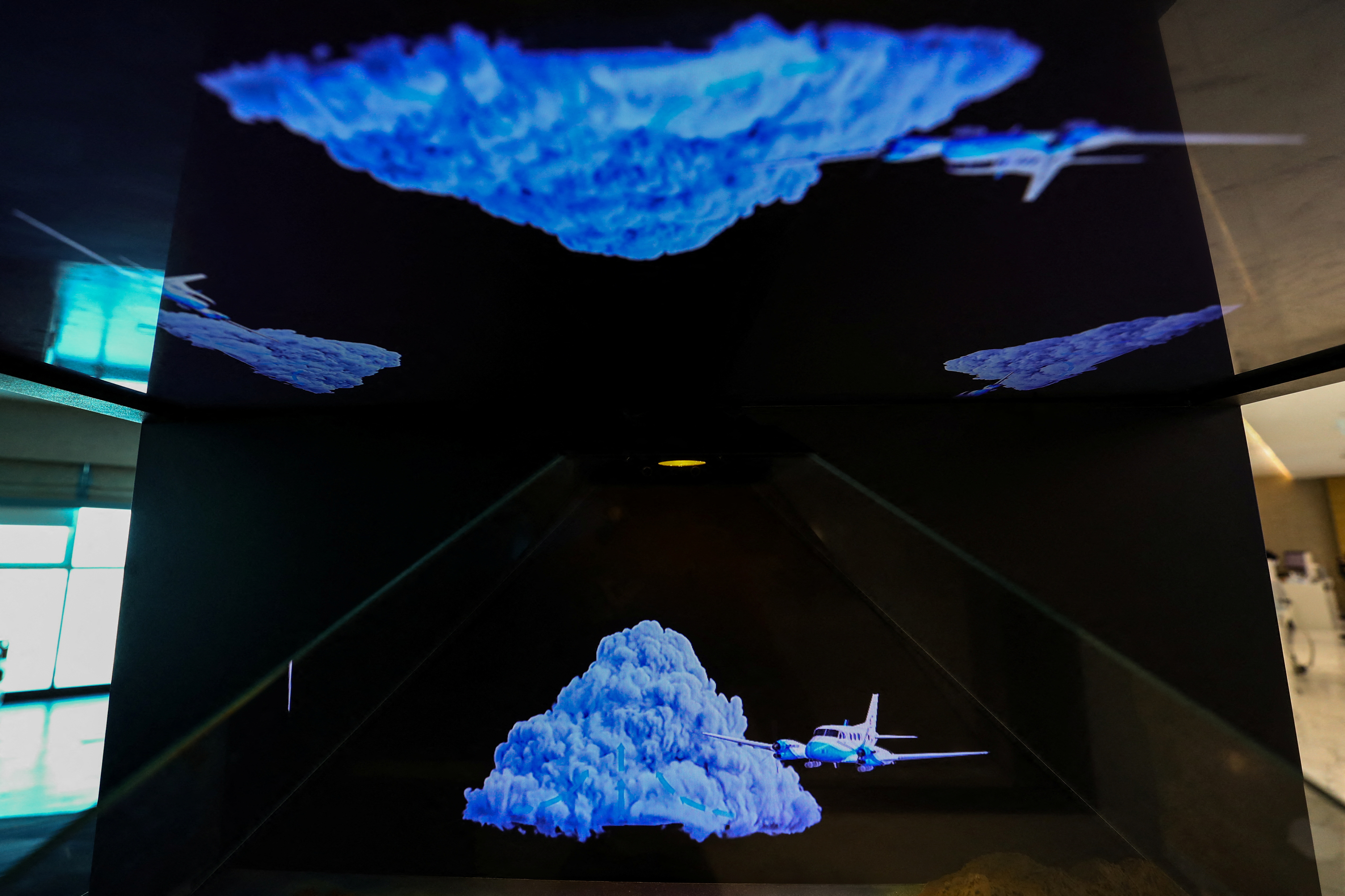 An explanatory hologram of the cloud seeding process is seen inside the control room at the National Center of Meteorology in Abu Dhabi