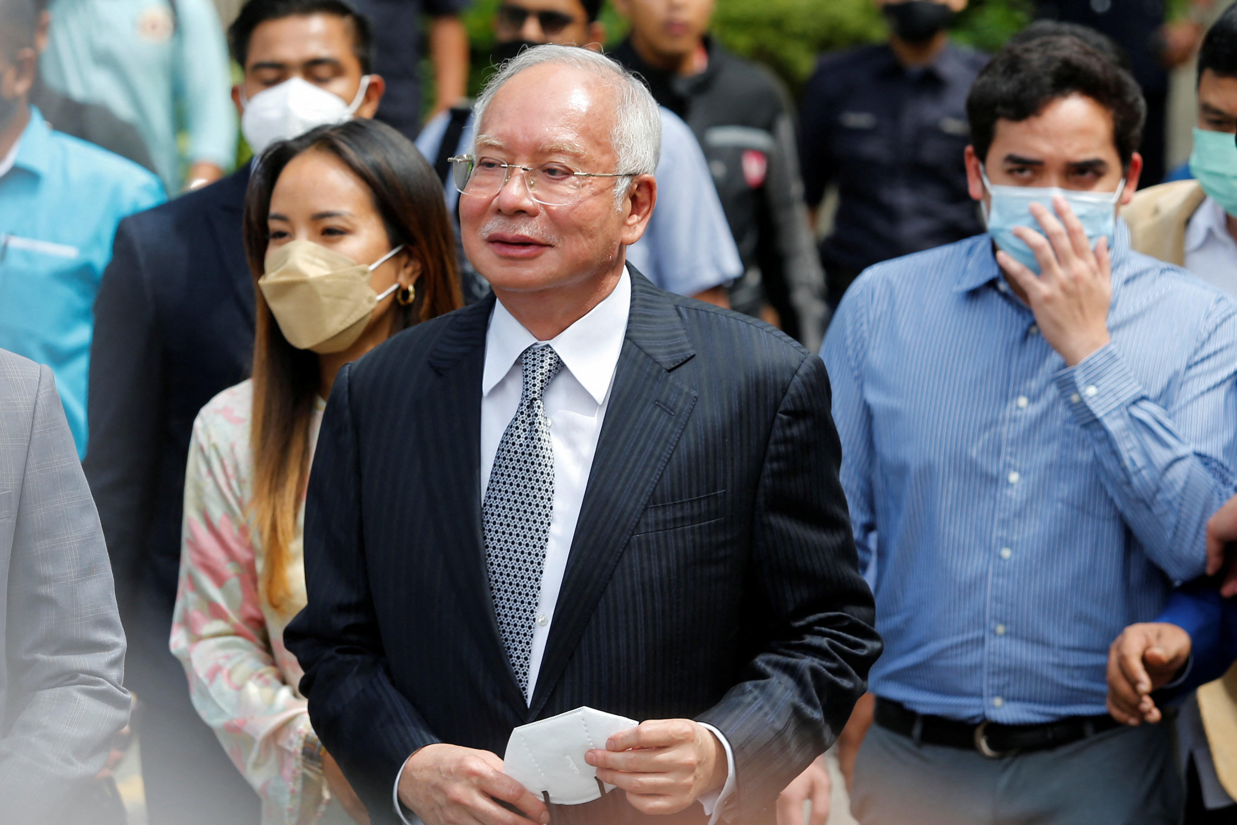 Former Malaysian Prime Minister Najib Razak walks out from the Federal Court during a court break, in Putrajaya