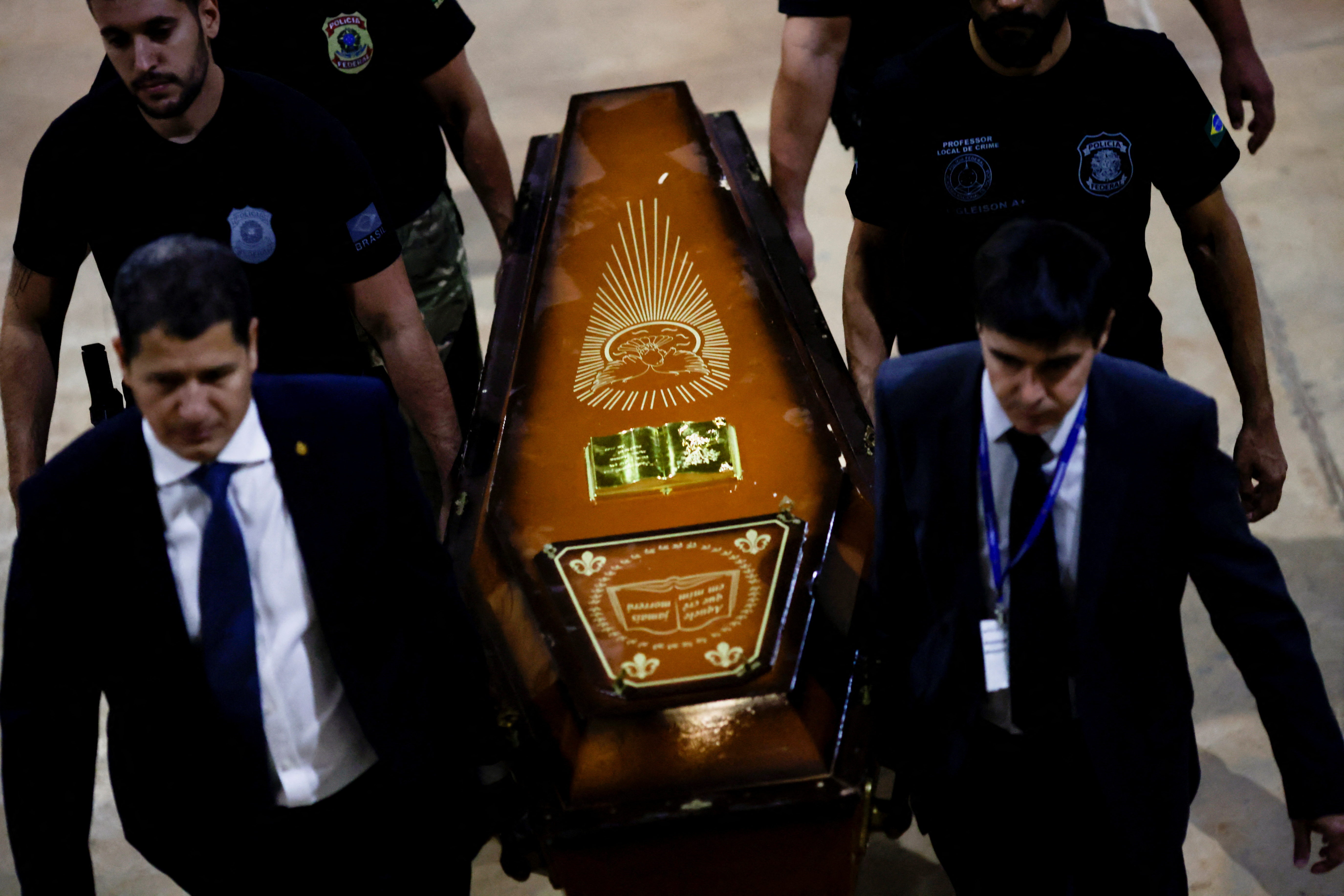 Federal Police officers carry a coffin containing human remains after a suspect confessed to killing British journalist Dom Phillips and Brazilian indigenous expert Bruno Pereira, in Brasilia