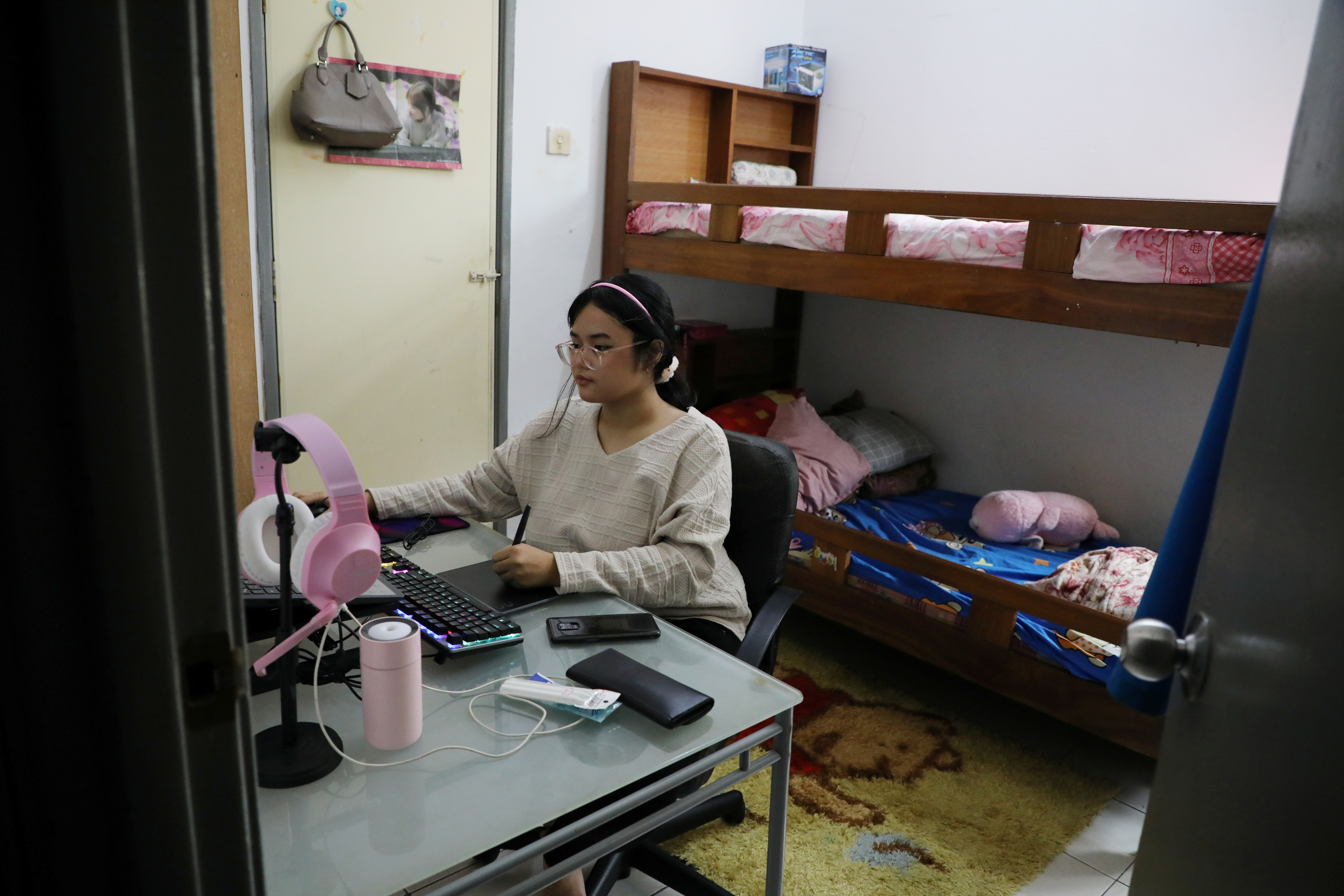Malaysian teenager Ain Husniza Saiful Nizam uses a computer in her bedroom in Kuala Selangor