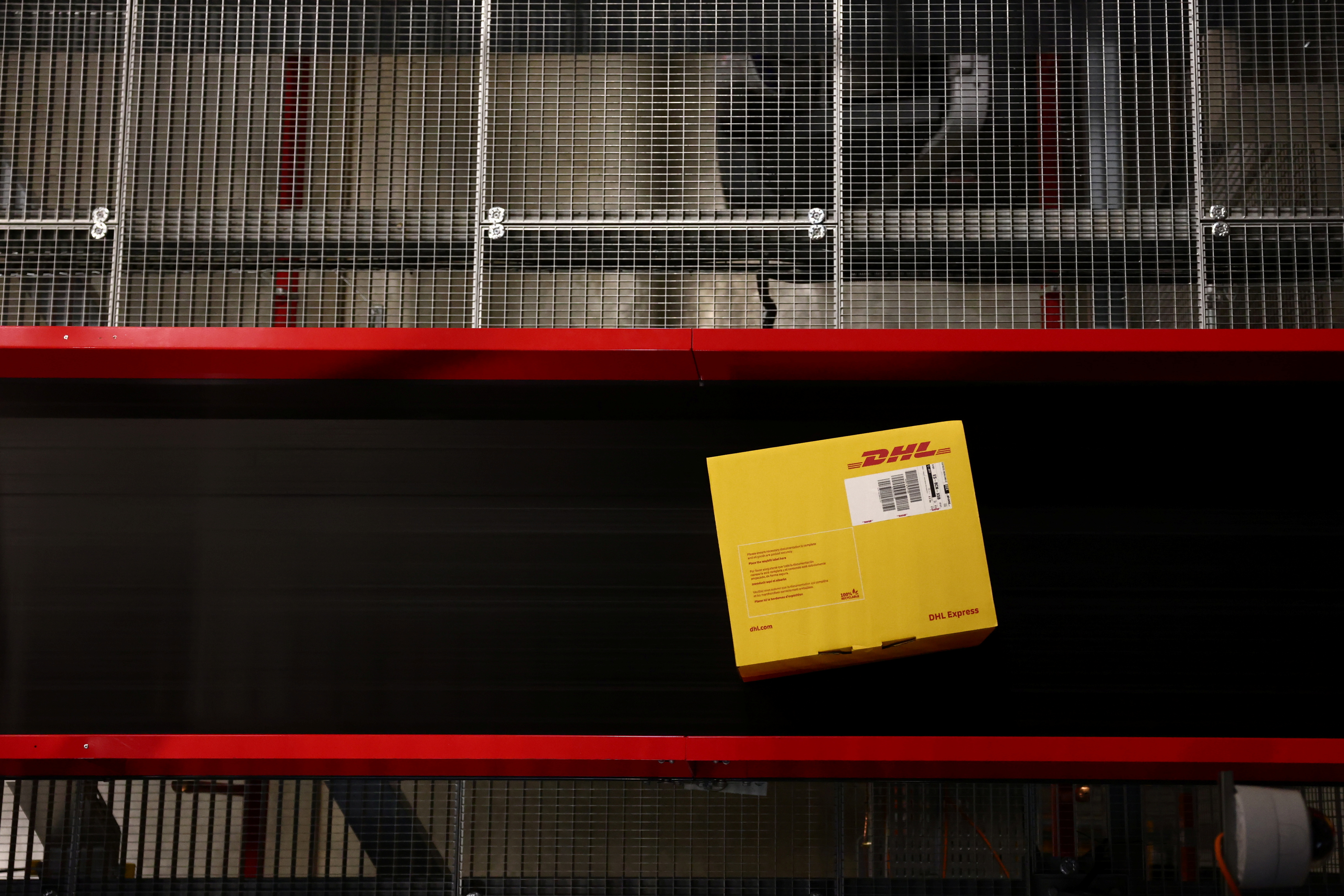 A DHL delivery package is seen in the new DHL Express hub near Paris