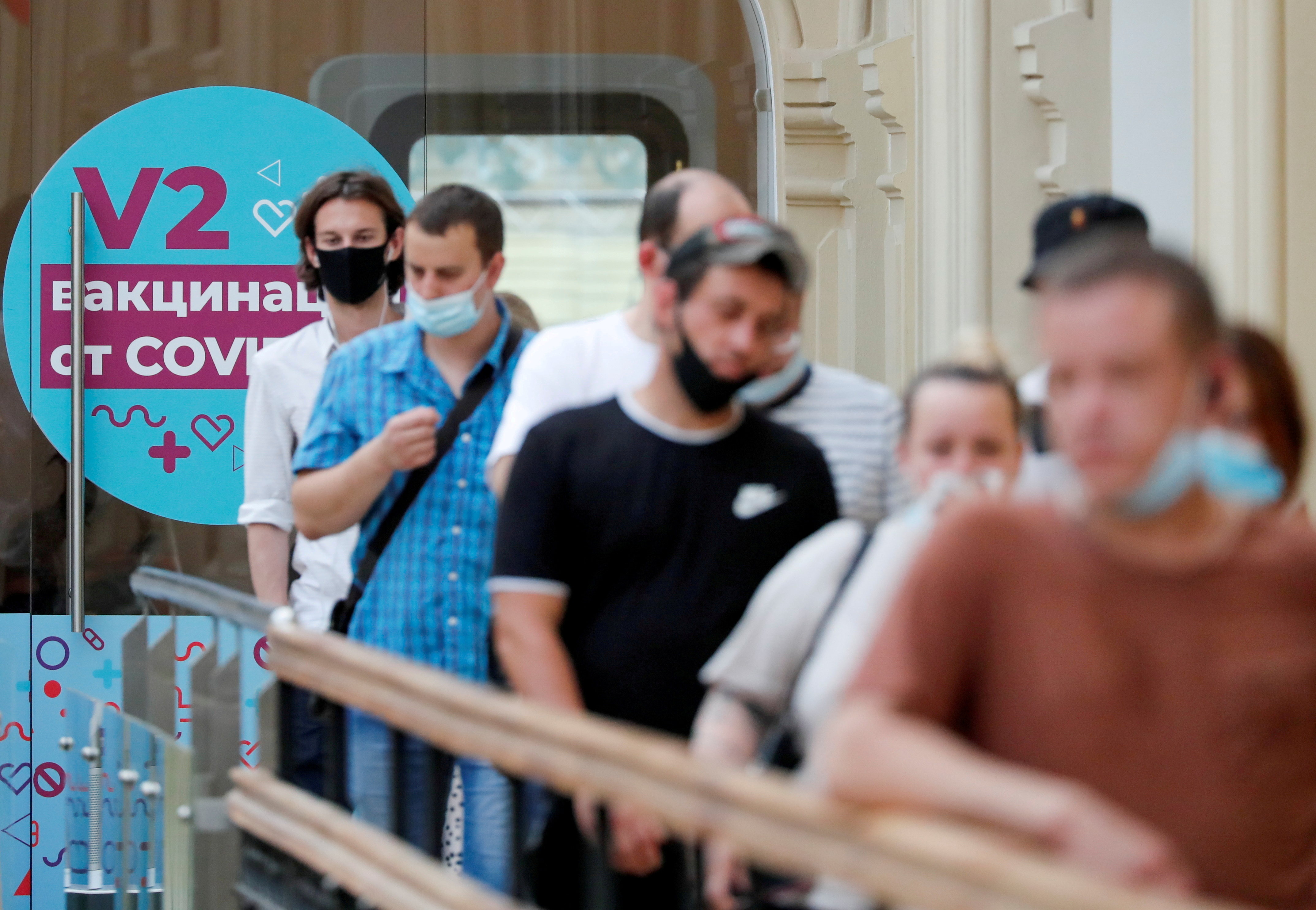 People line up to receive vaccine against the coronavirus disease (COVID-19) outside a vaccination centre in the State Department Store, GUM, in central Moscow, Russia June 25, 2021. REUTERS/Shamil Zhumatov
