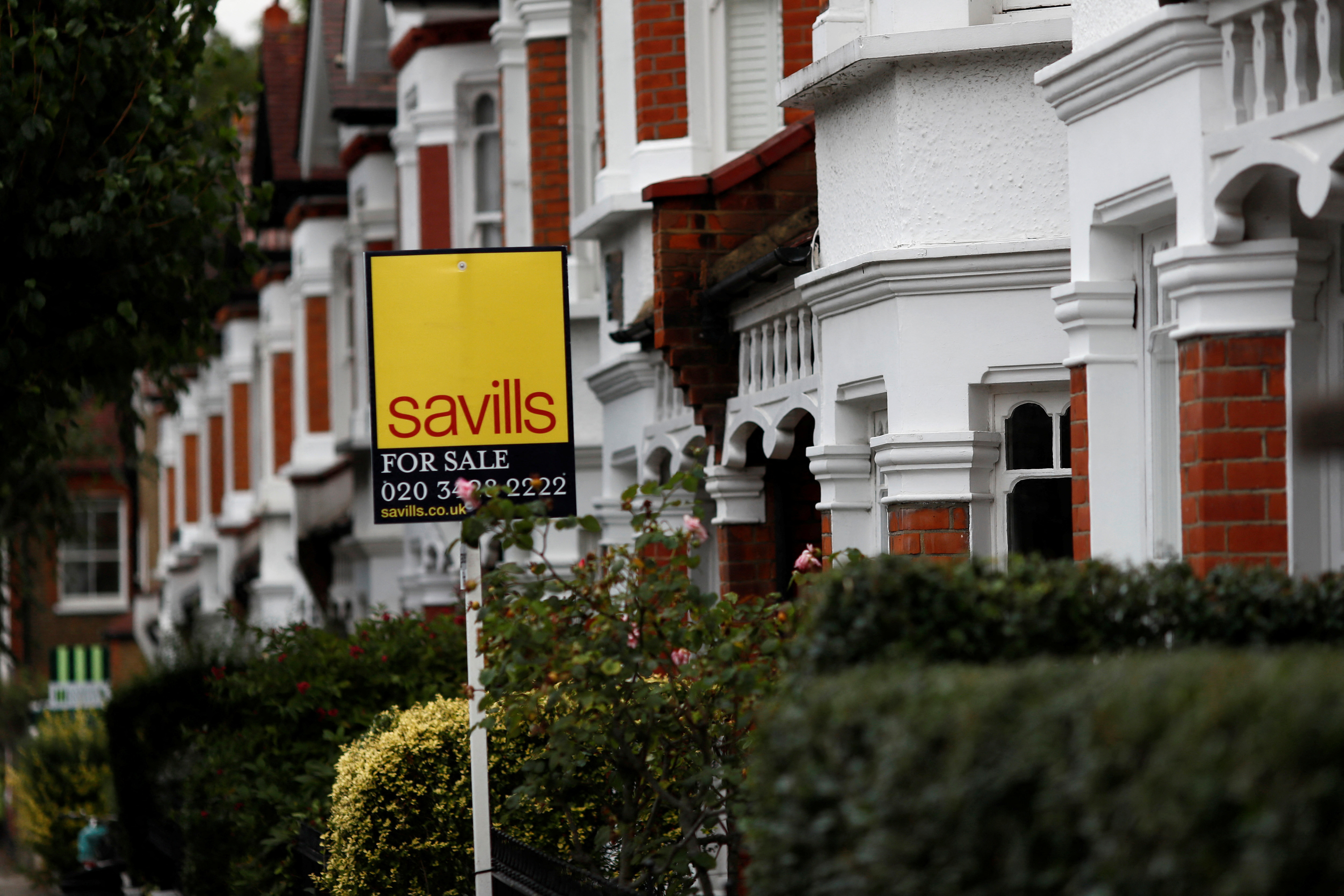 A Savills property estate agent sign is displayed outside a home in south London