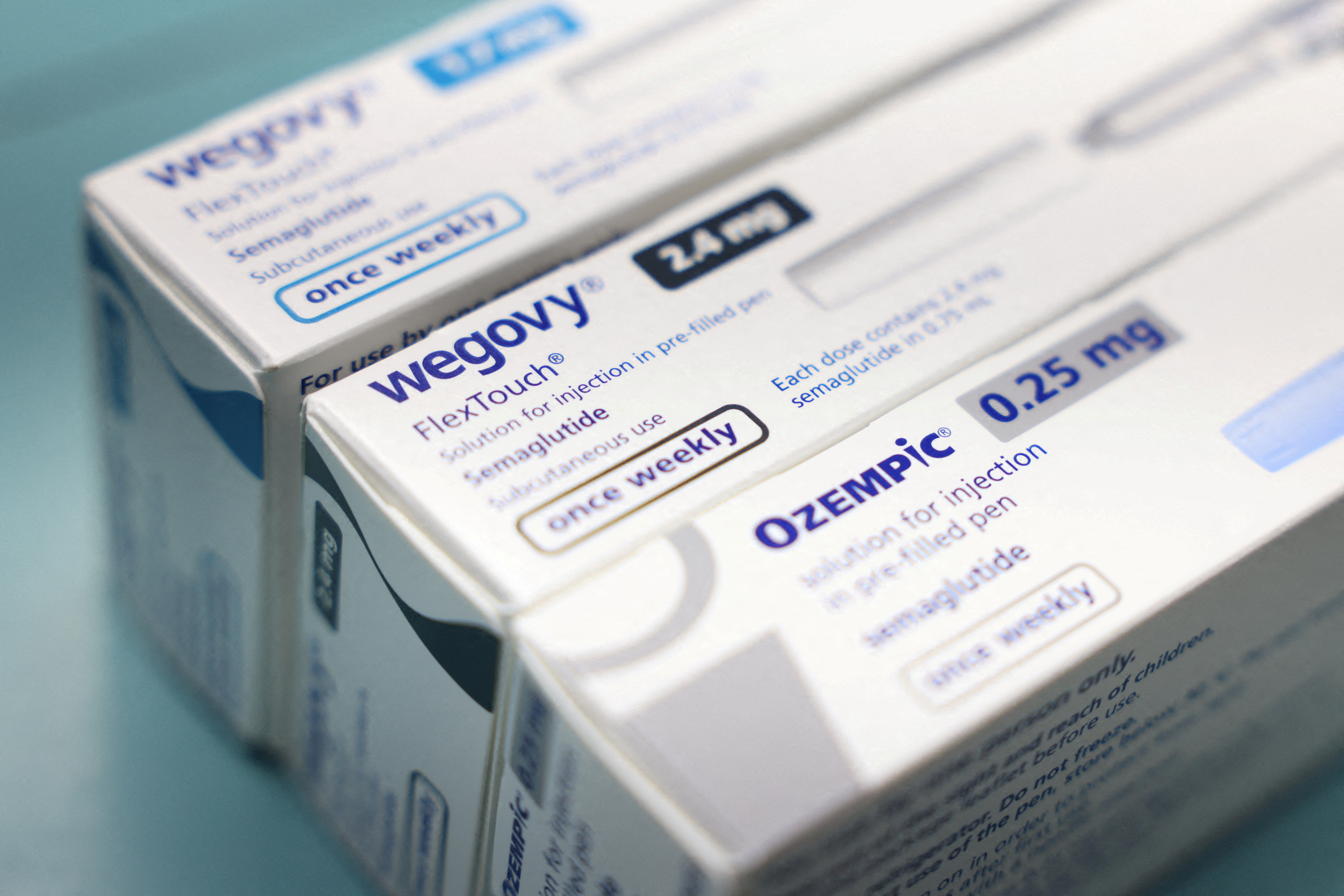 Boxes of Ozempic and Wegovy made by Novo Nordisk are seen at a pharmacy in London