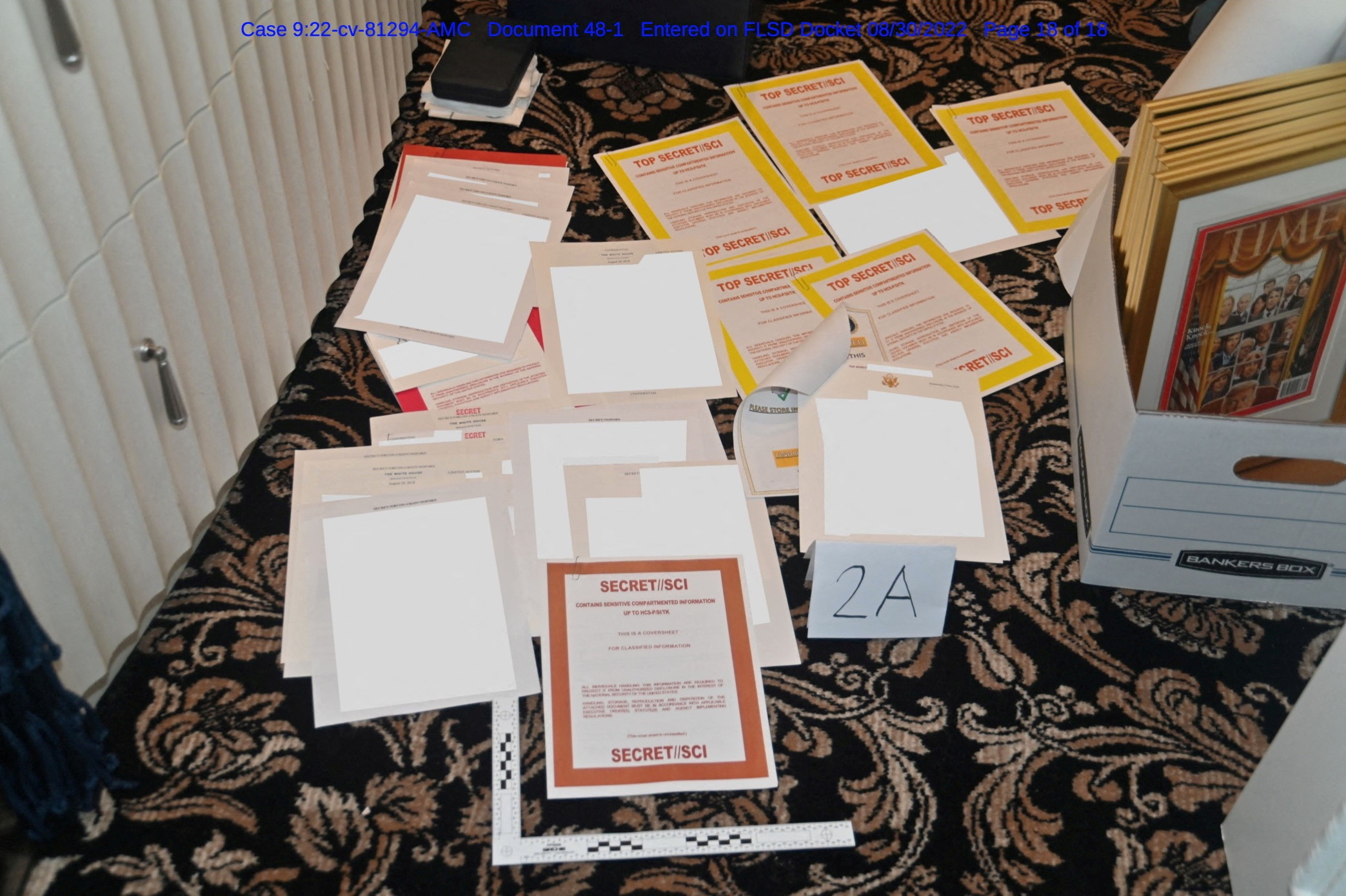 Redacted FBI Photos of Documents and Classified Cover Sheets Recovered from Containers Stored at Former President Donald Trump's Florida Mansion