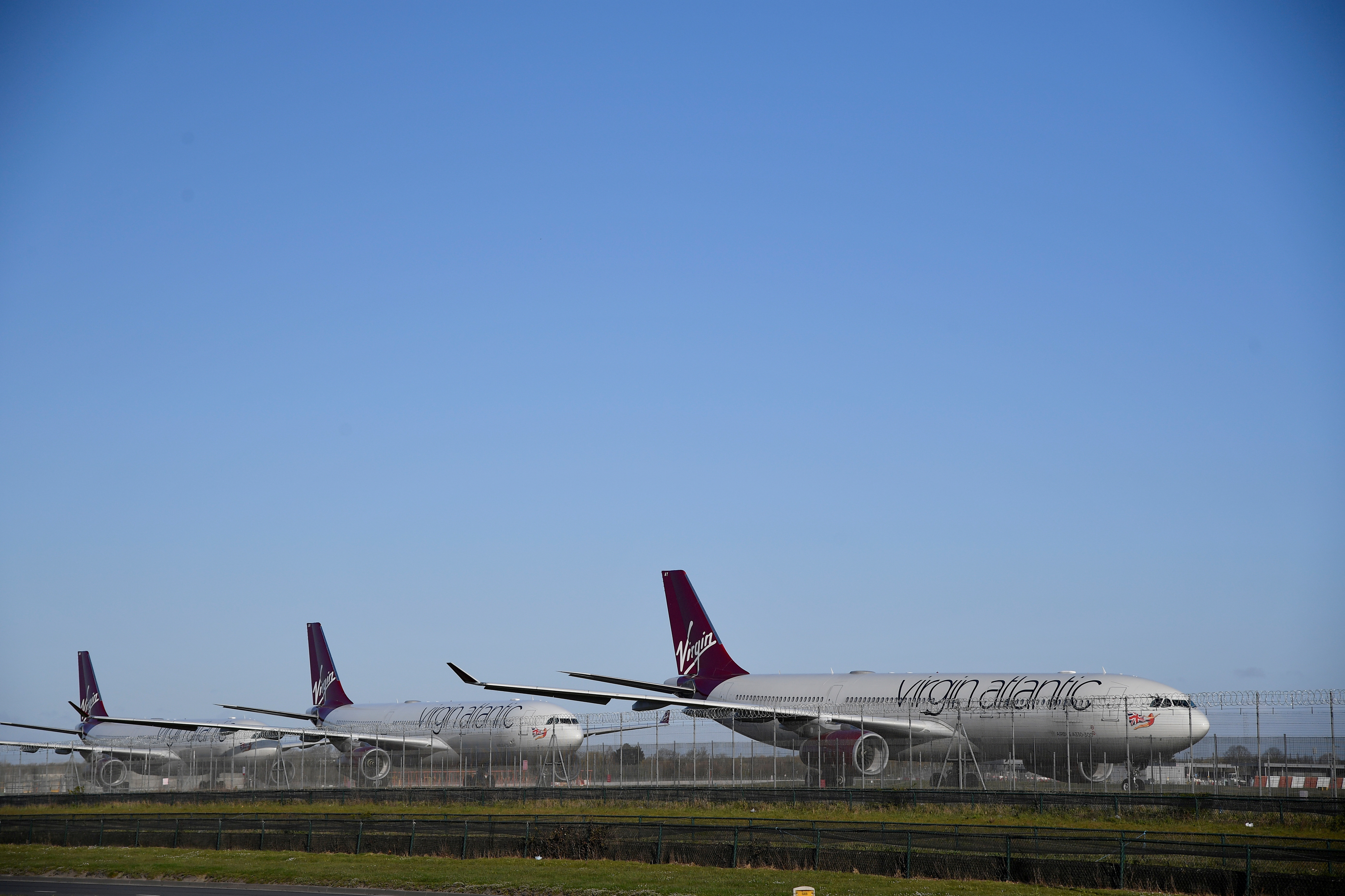 Virgin Atlantic planes are seen at Heathrow airport as the spread of the coronavirus disease (COVID-19) continues, London, Britain, March 31, 2020. REUTERS/Toby Melville/File Photo