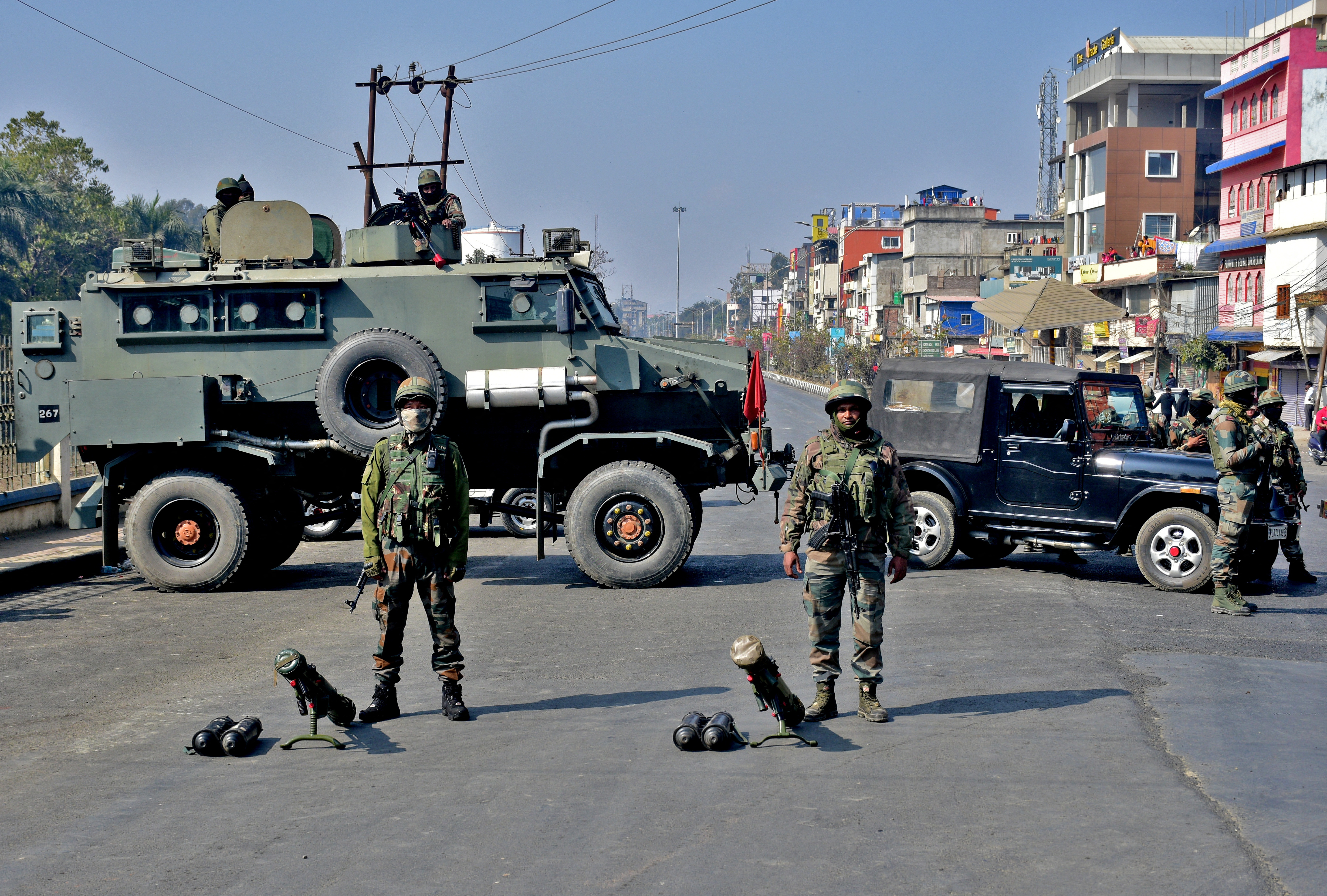 Soldiers block a road in Imphal, the capital of Manipur