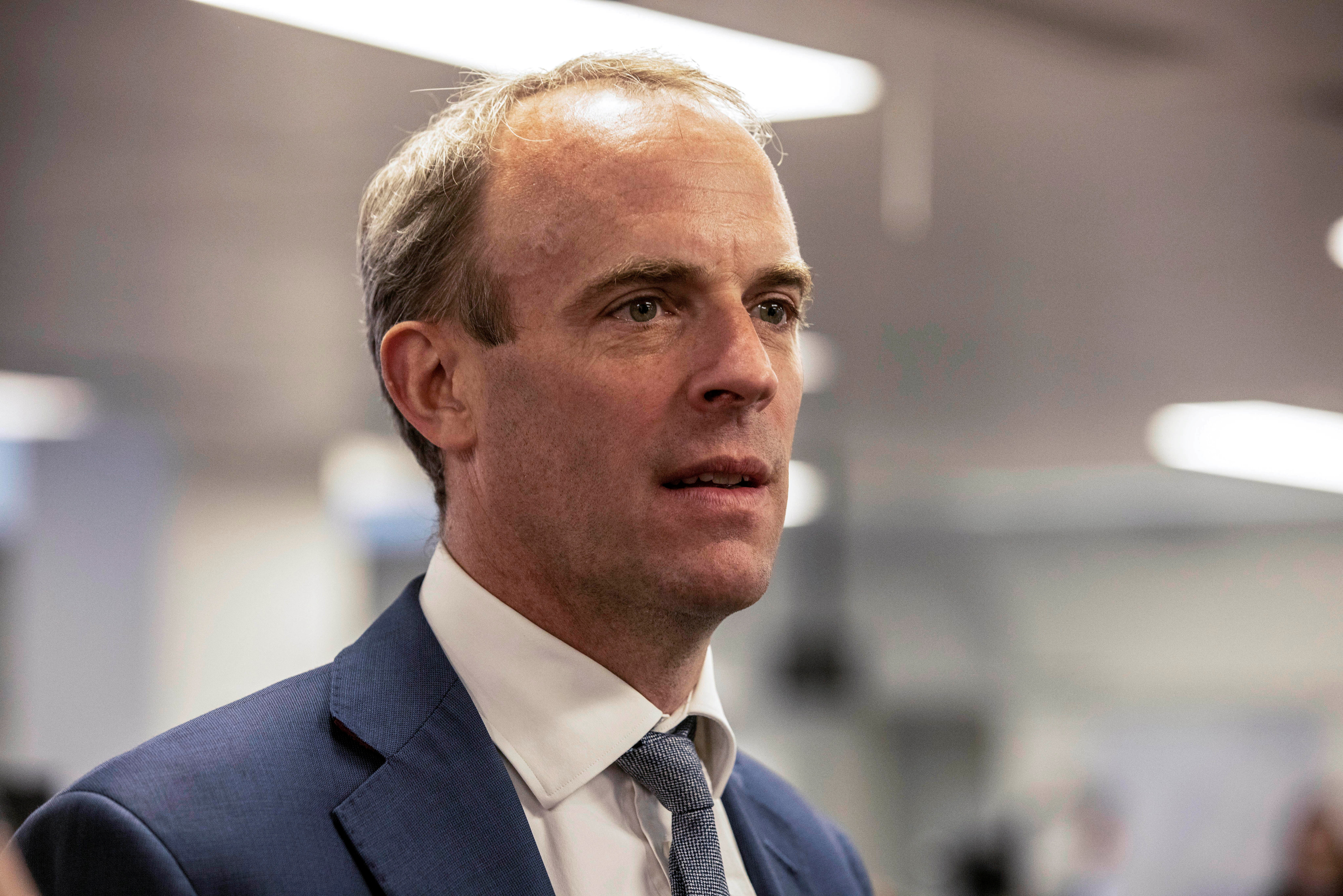 Britain's PM Johnson and Foreign Secretary Raab visit FCDO Crisis Centre in London