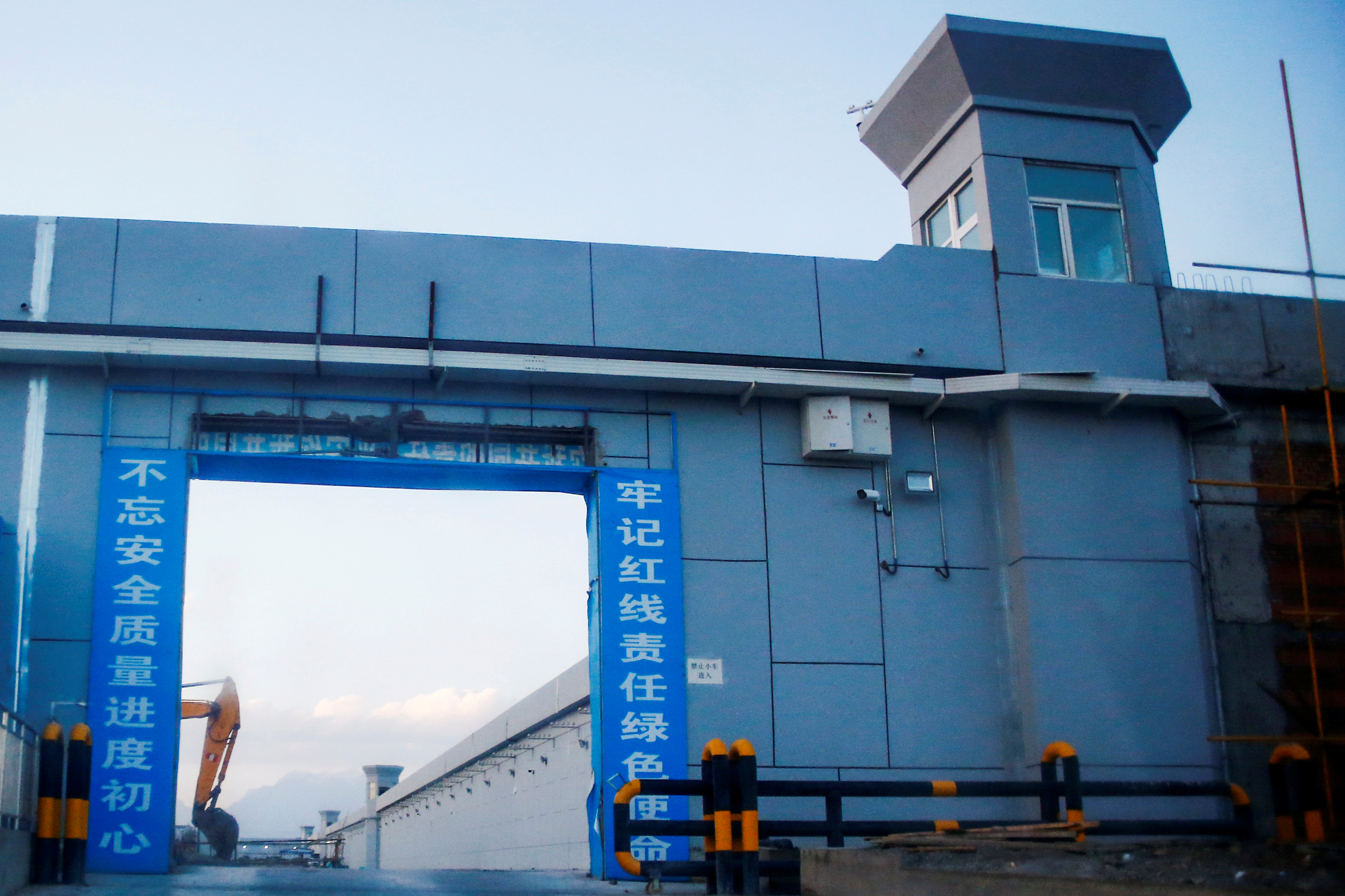 A gate of what is officially known as a vocational skills education centre is photographed in Dabancheng