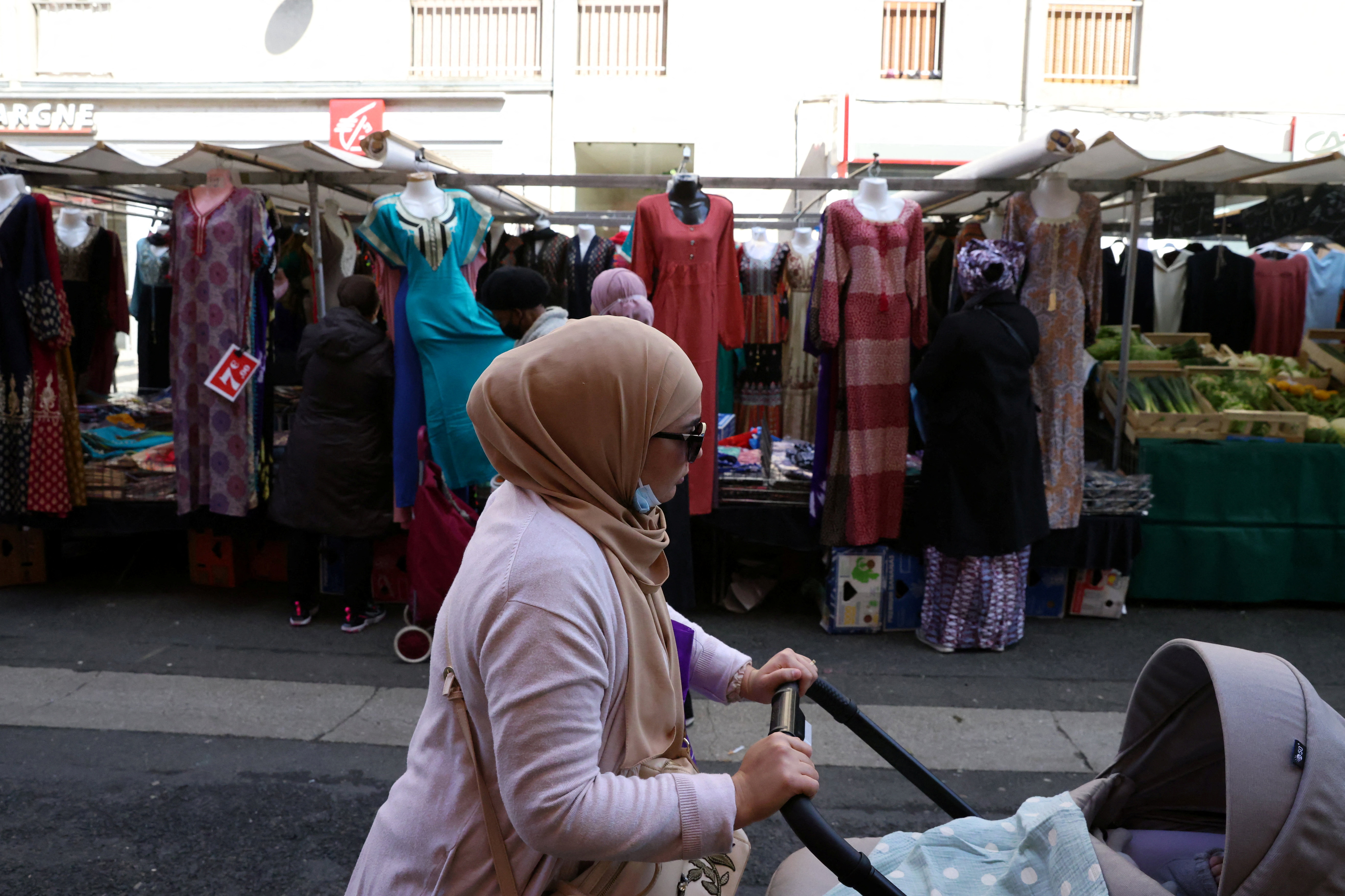 Voting for Macron is a bitter pill to swallow for some French Muslims |  Reuters