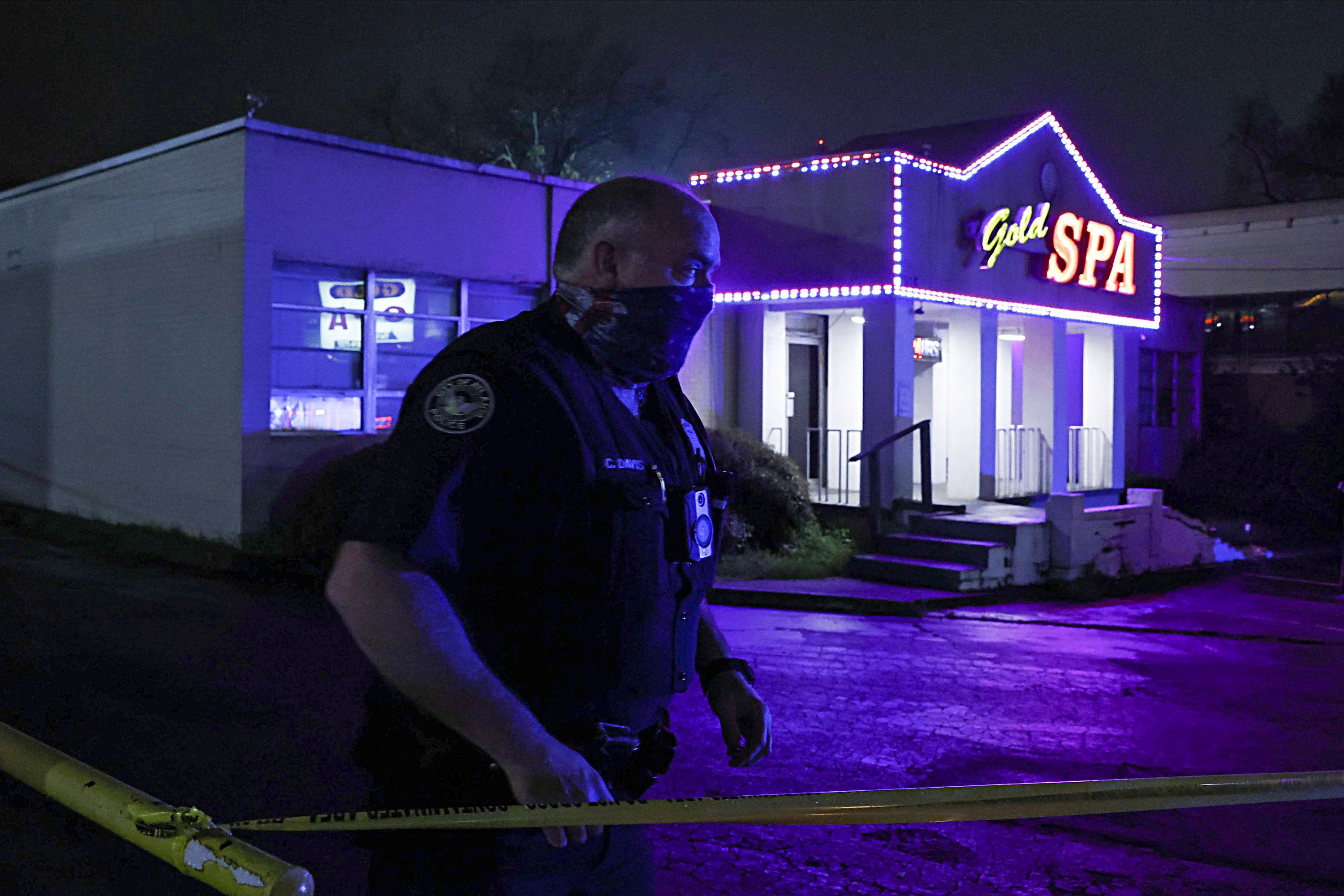 City of Atlanta Police Officer Davis works at the scene outside of Gold Spa after deadly shootings in the Atlanta area