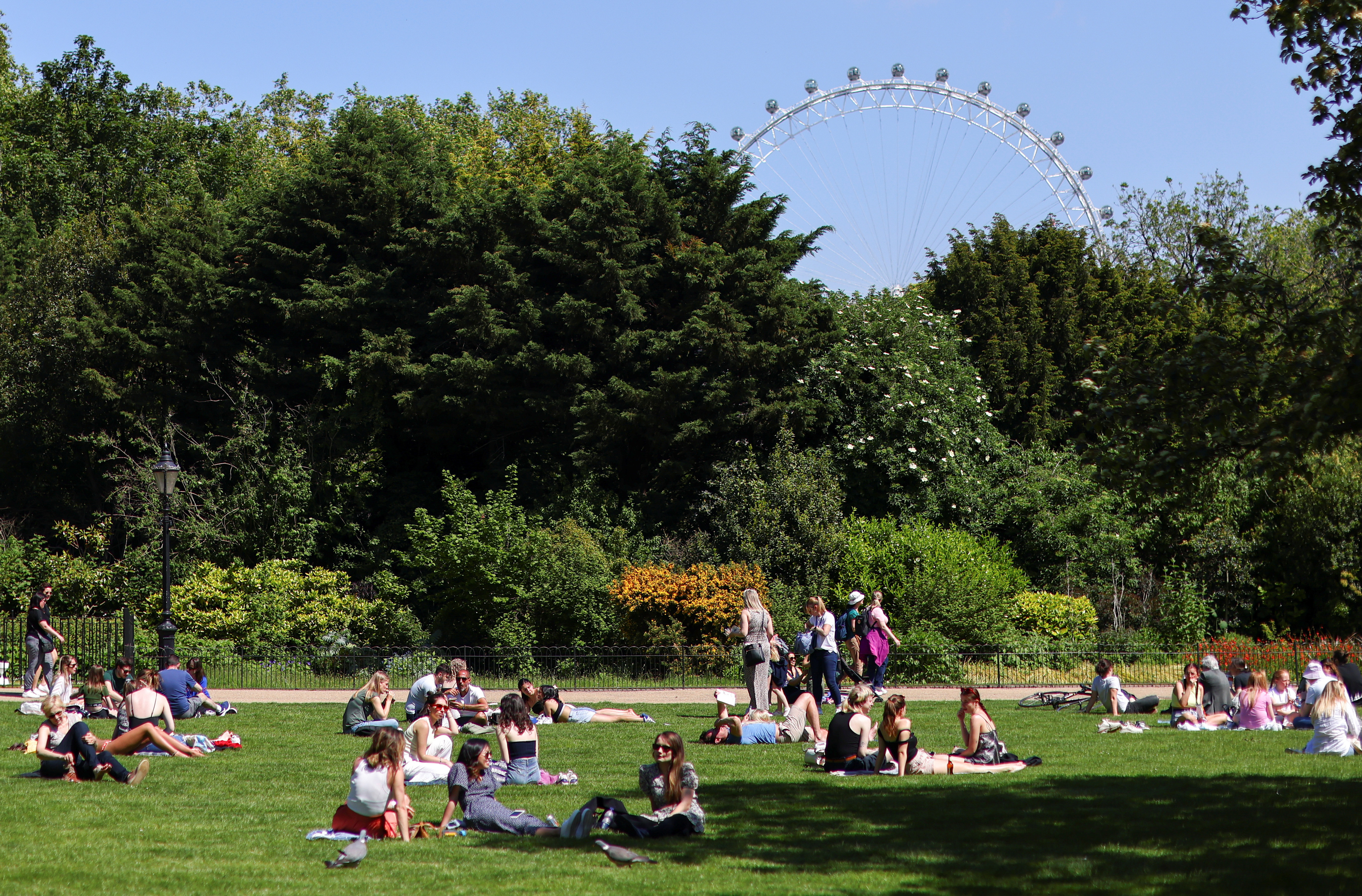 People enjoy the sunny weather in London
