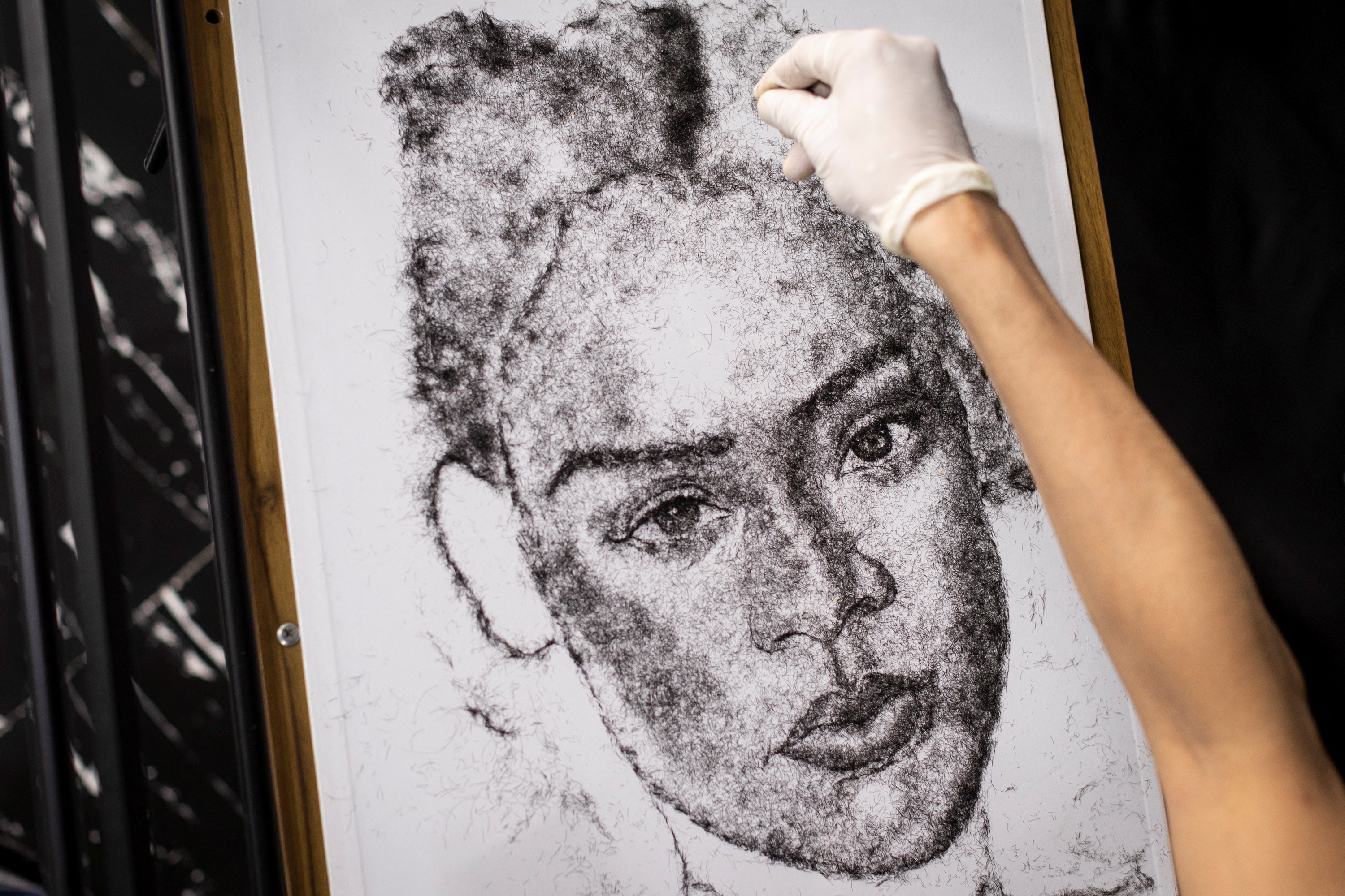 A hairy idea: Filipino artist uses own hair to create portraits