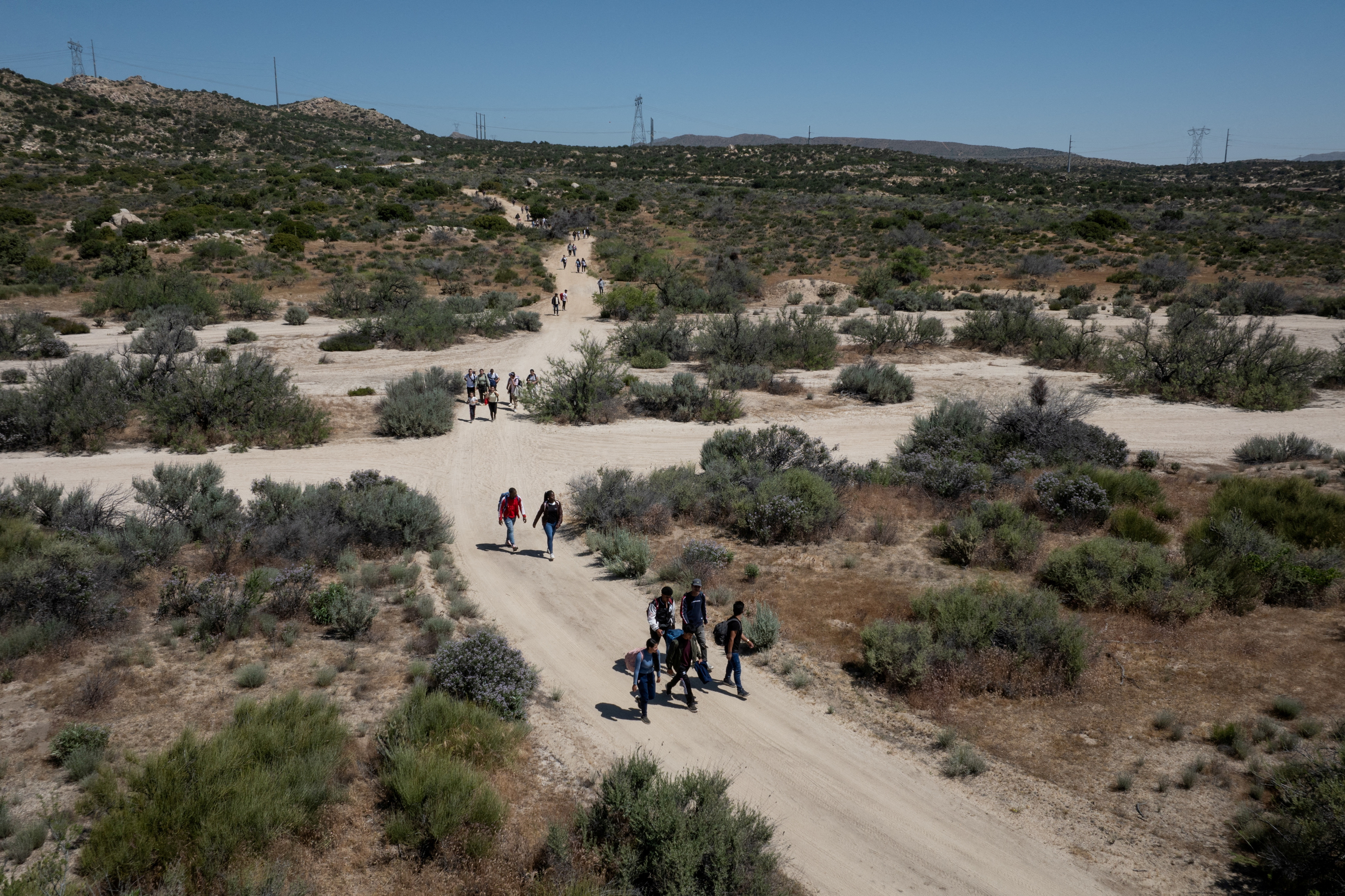 Asylum-seeking migrants enter the United States from Mexico in Jacumba Hot Springs
