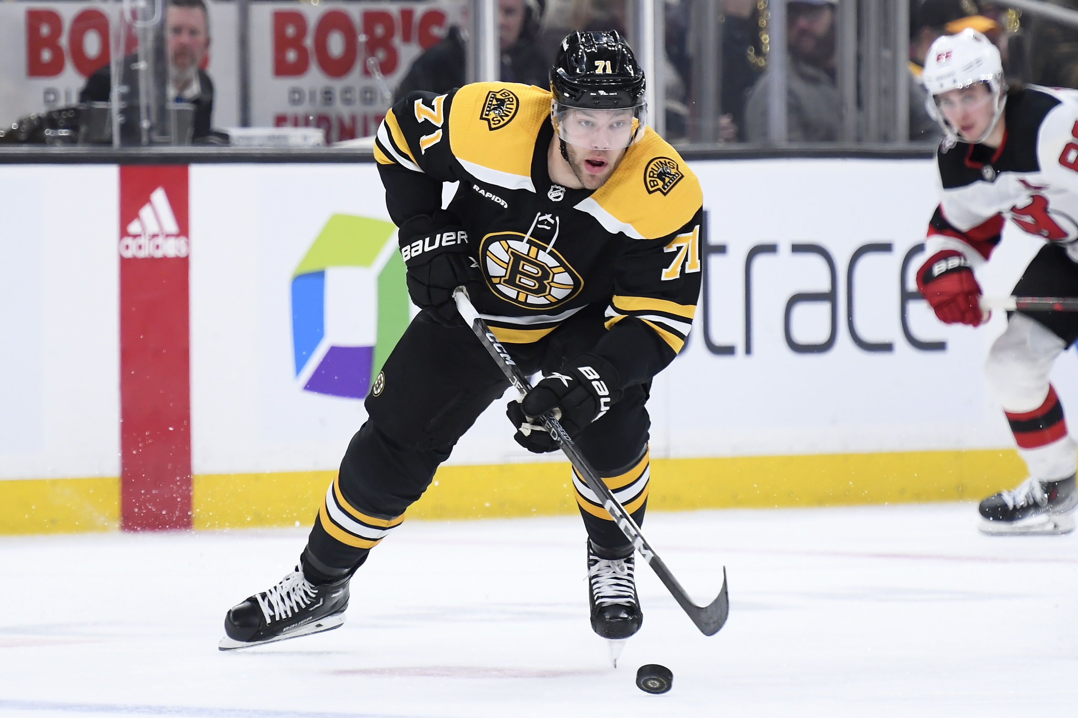 Bruins defeat Devils, tie NHL single-season wins mark | Reuters