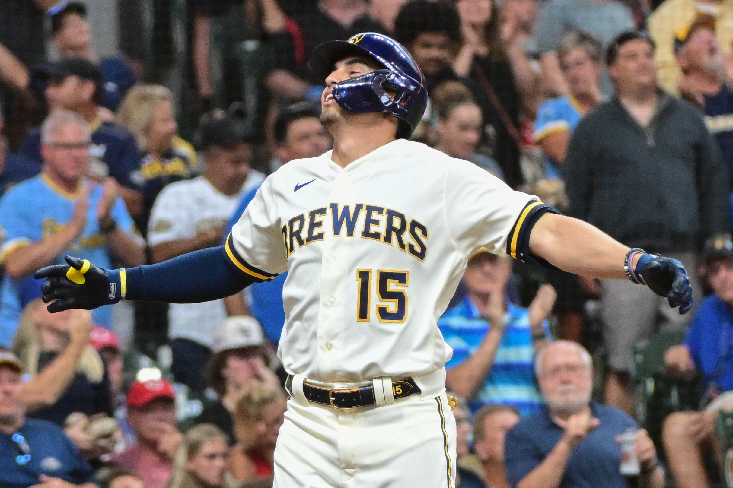 Peralta's arm, Taylor's bat lead Brewers past Reds