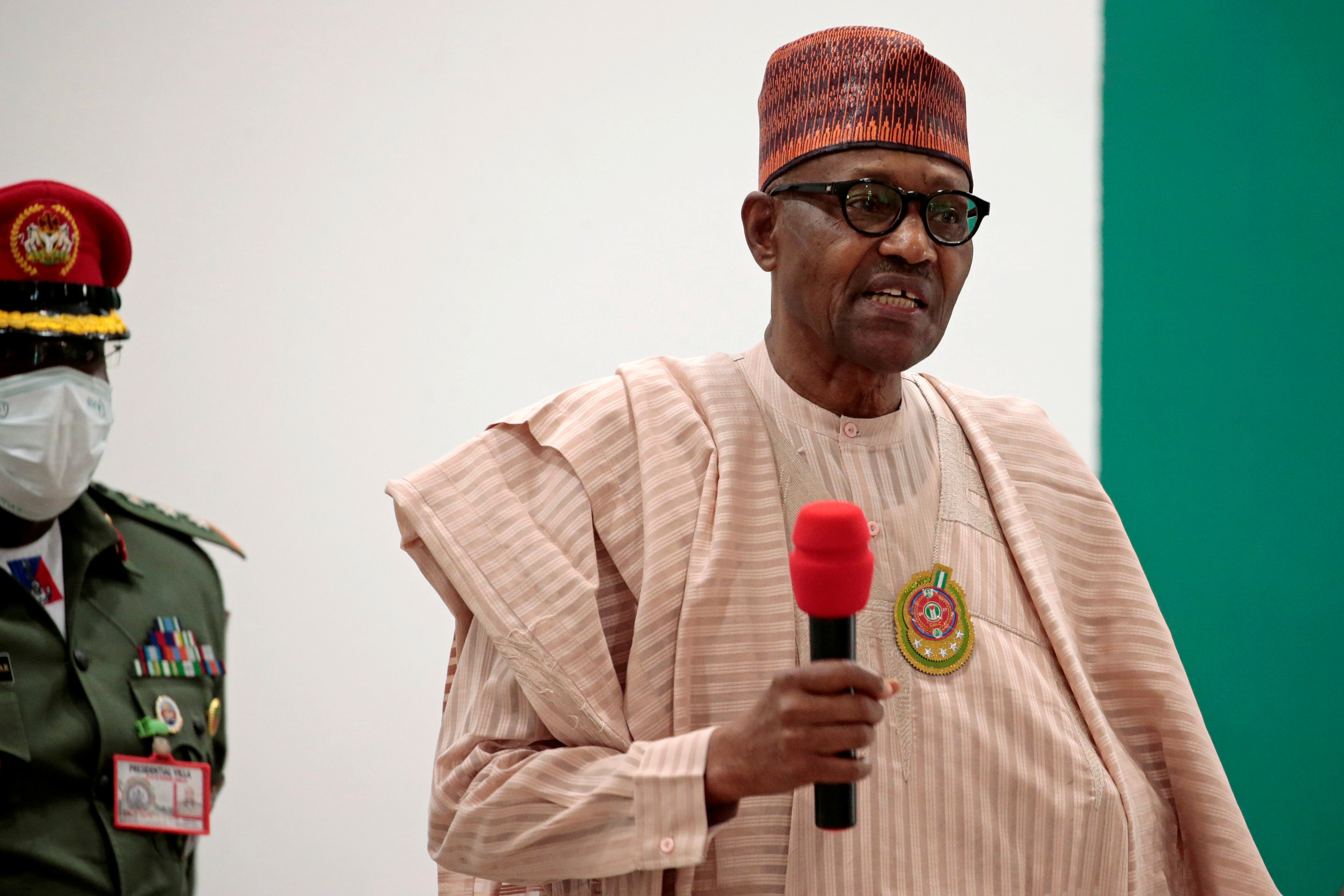 FILE PHOTO: Nigerian President Muhammadu Buhari speaks after security forces rescued schoolboys from kidnappers, in Katsina, Nigeria
