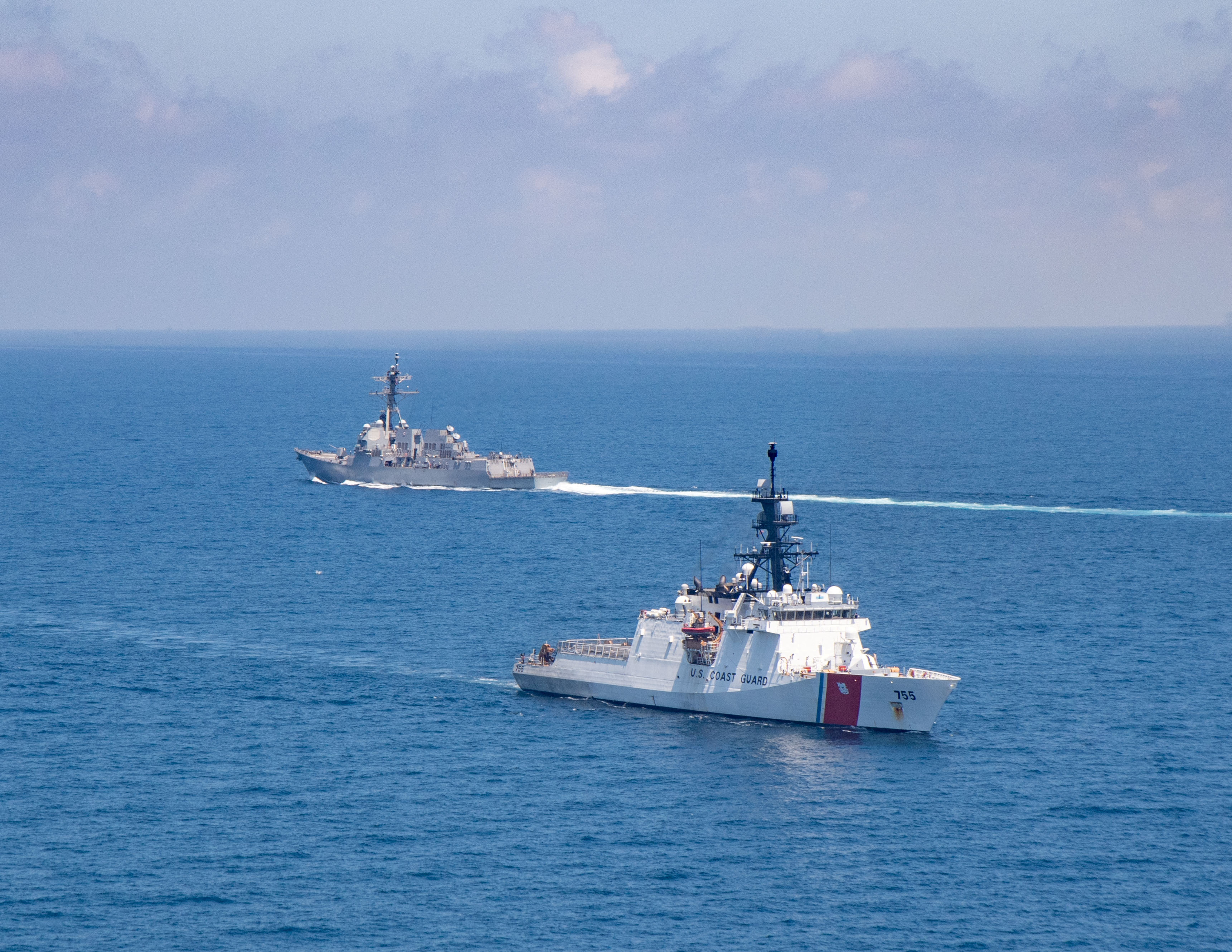 The Arleigh Burke-class guided-missile destroyer USS Kidd and legend-class U.S. Coast Guard National Security Cutter Munro conduct Taiwan Strait transits