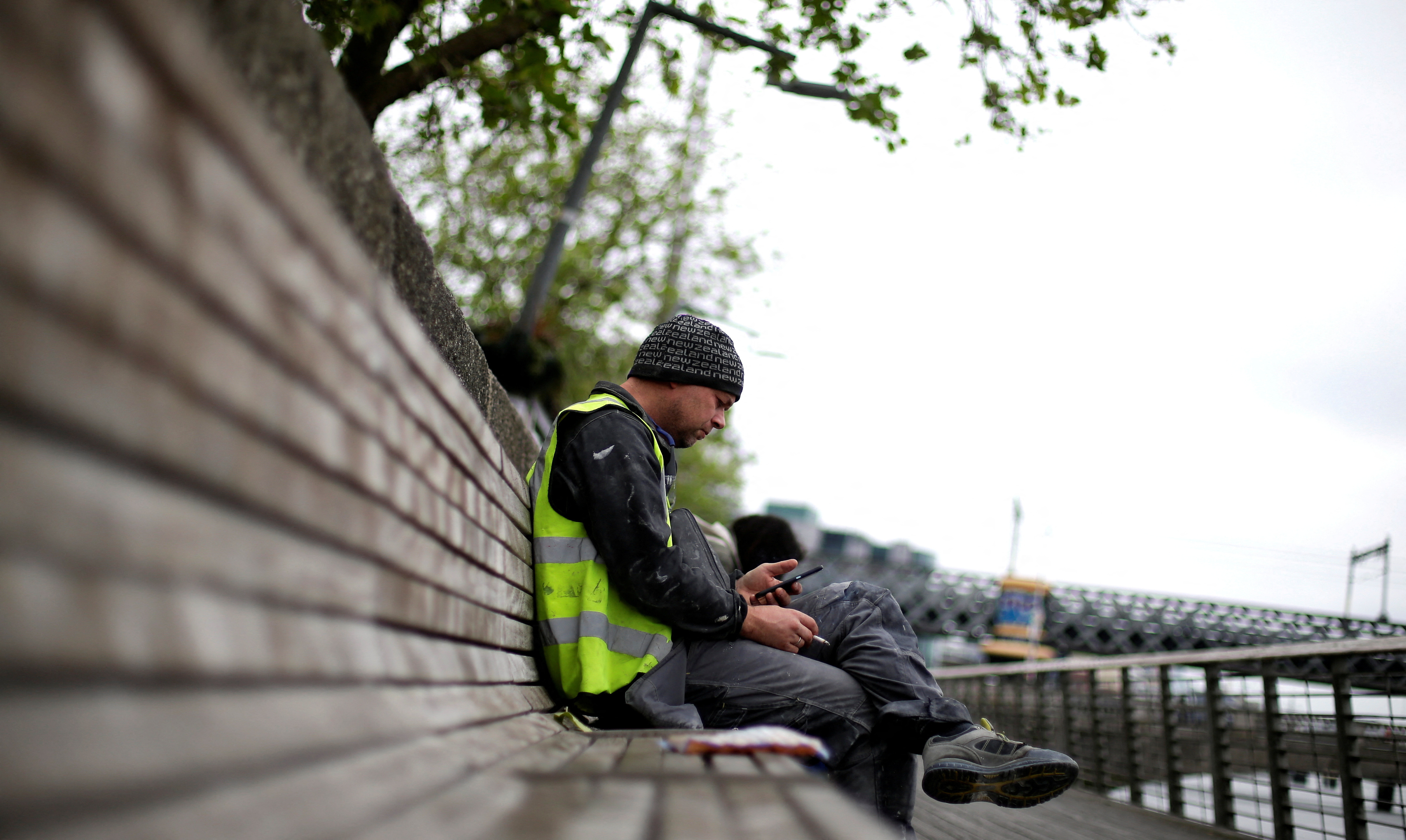A man checks his phone in the city centre of Dublin