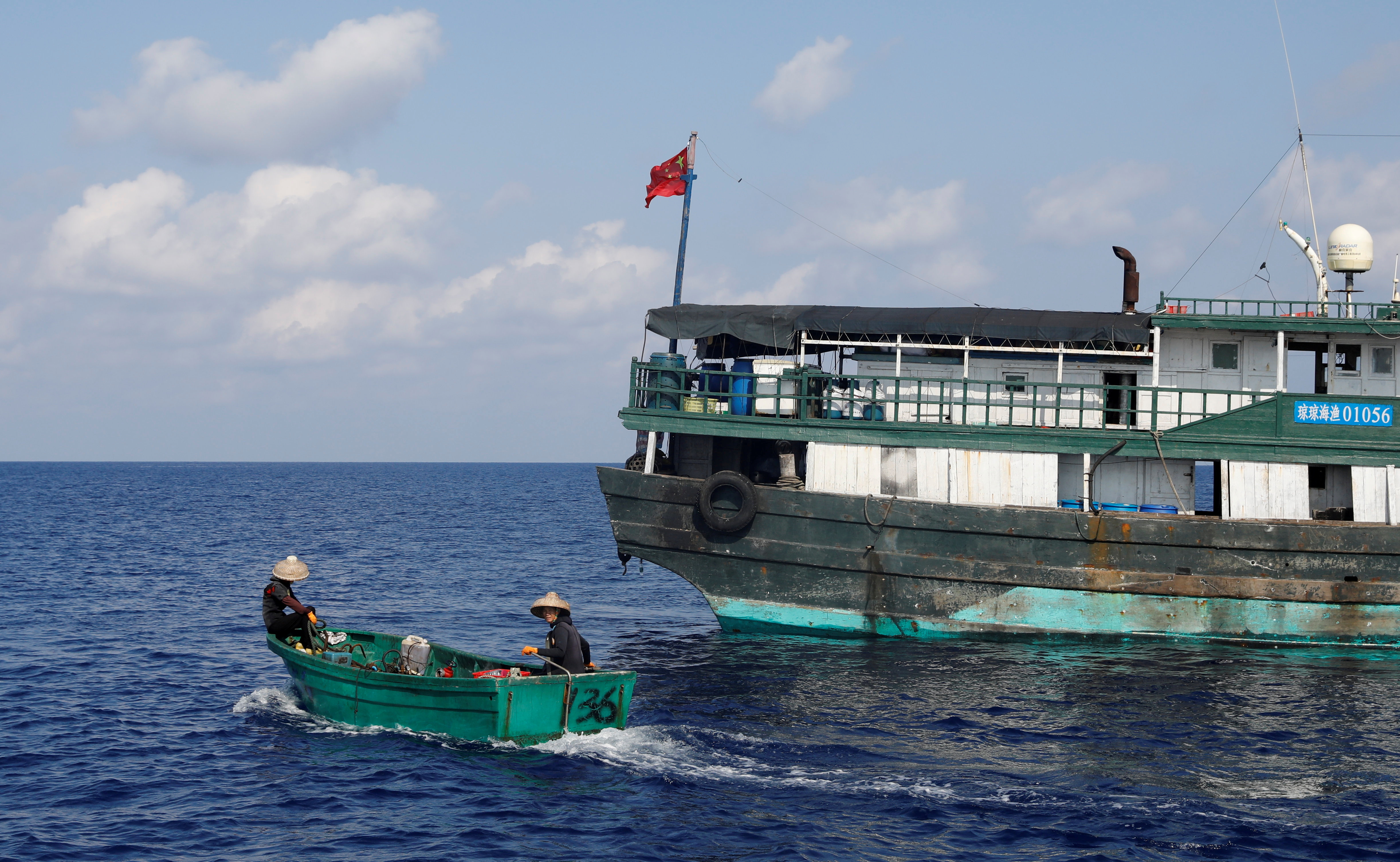 Chinese fishermen head to the shoal to fish at the disputed Scarborough Shoal
