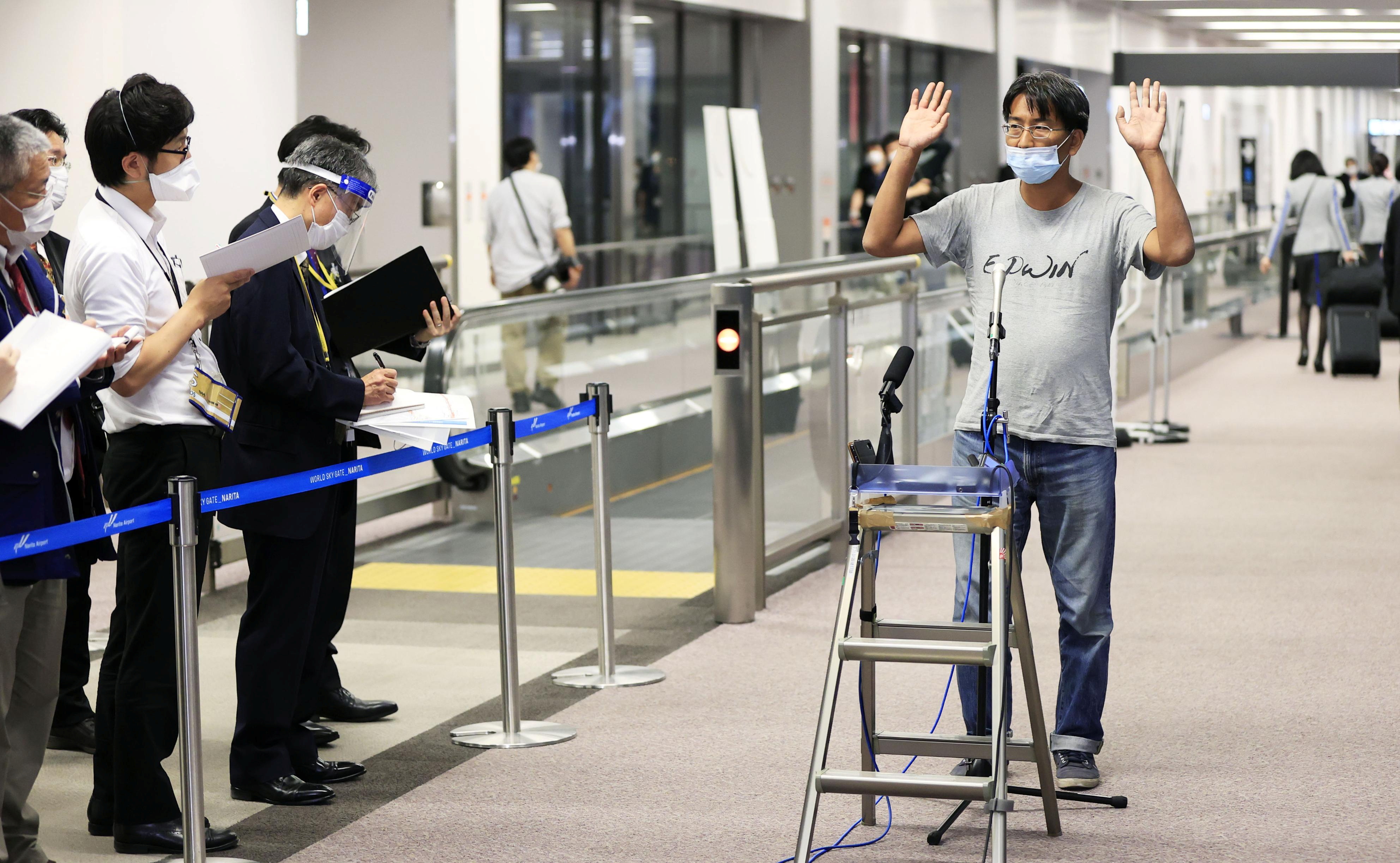 Japanese journalist Yuki Kitazumi who was detained in Myanmar speaks to media upon his arrival at Narita Airport in Narita, Japan