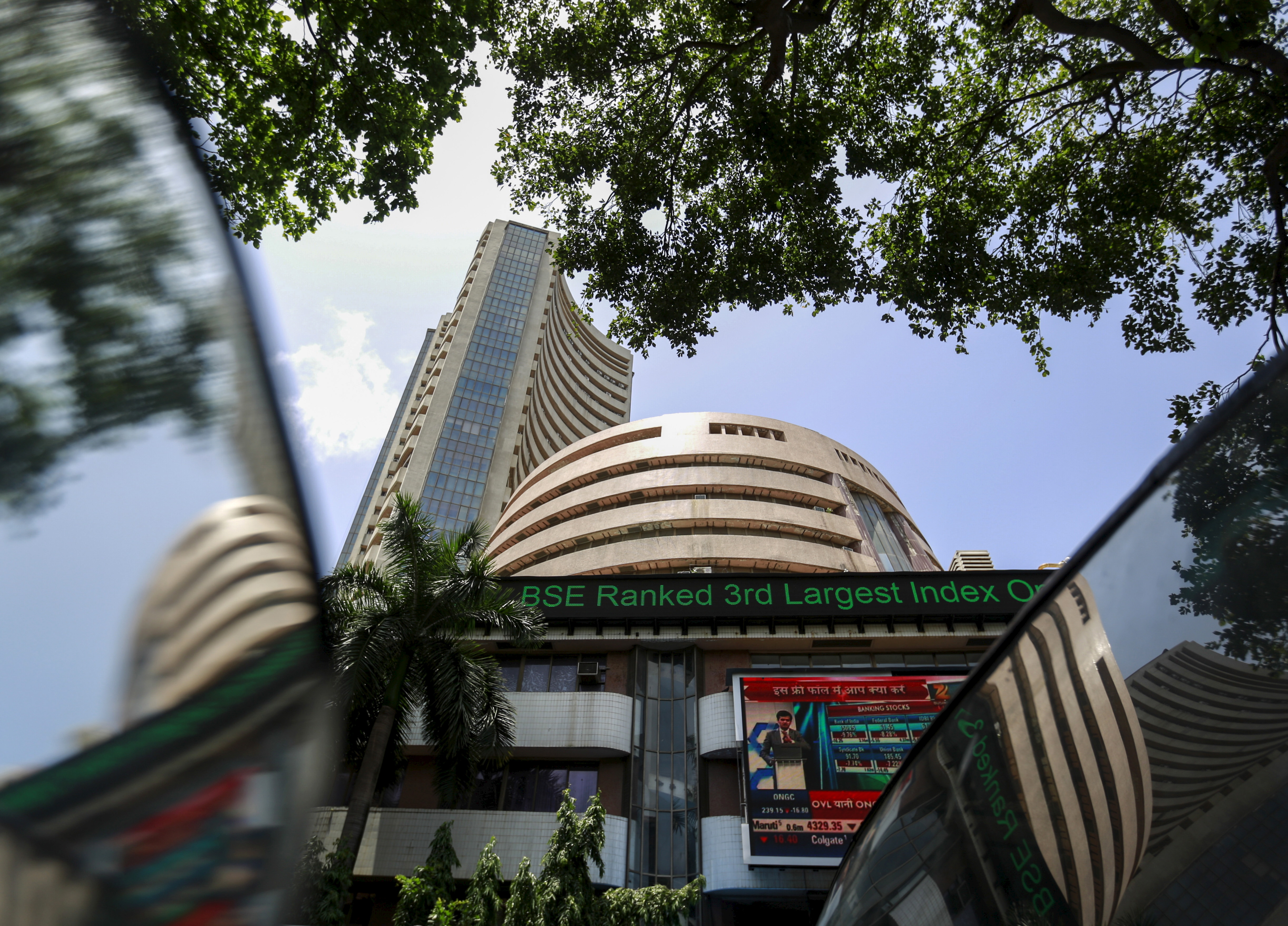 Bombay Stock Exchange building is pictured next to police van in Mumbai