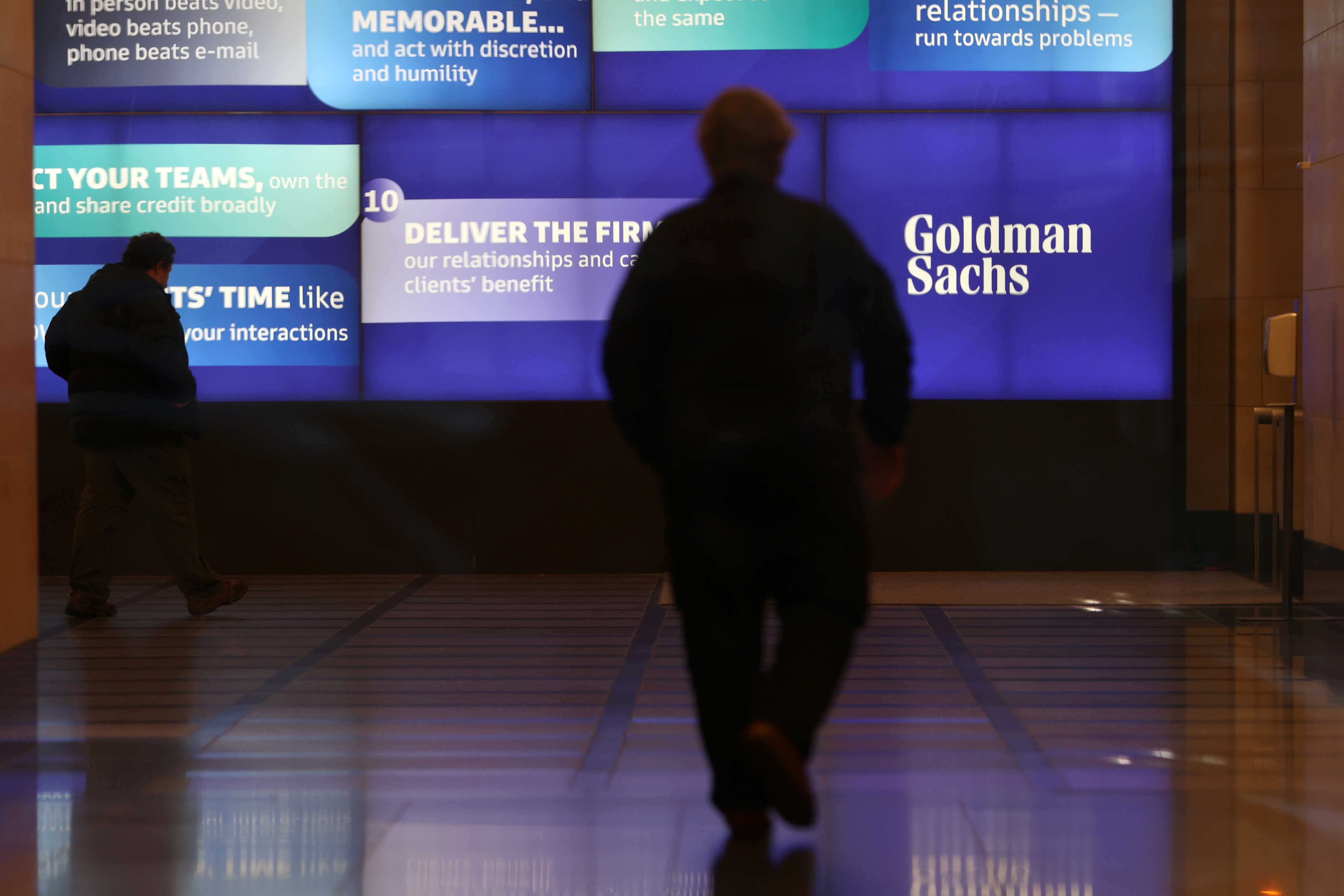 People walk in the Goldman Sachs global headquarters in Manhattan, New York