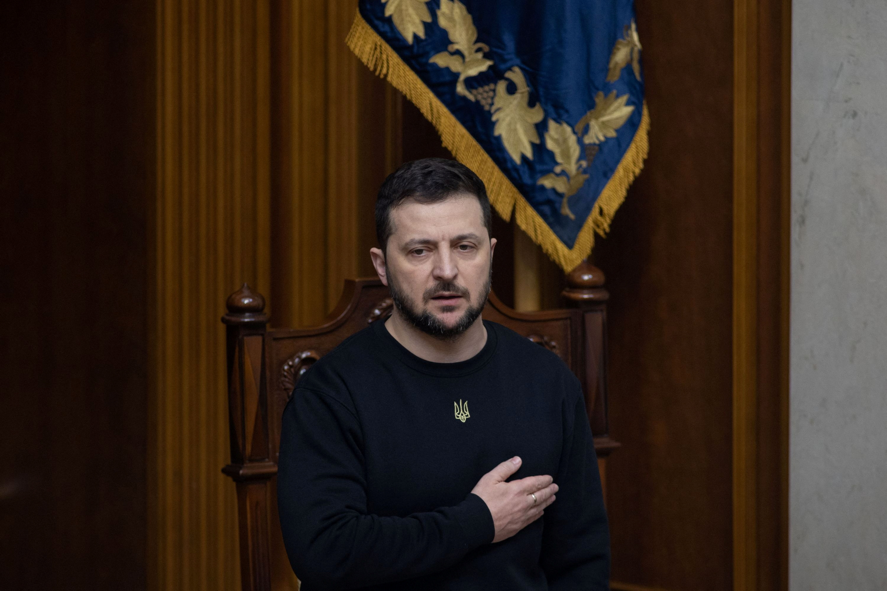 Ukraine's President Zelenskiy sings the national anthem during a session of the Parliament in Kyiv