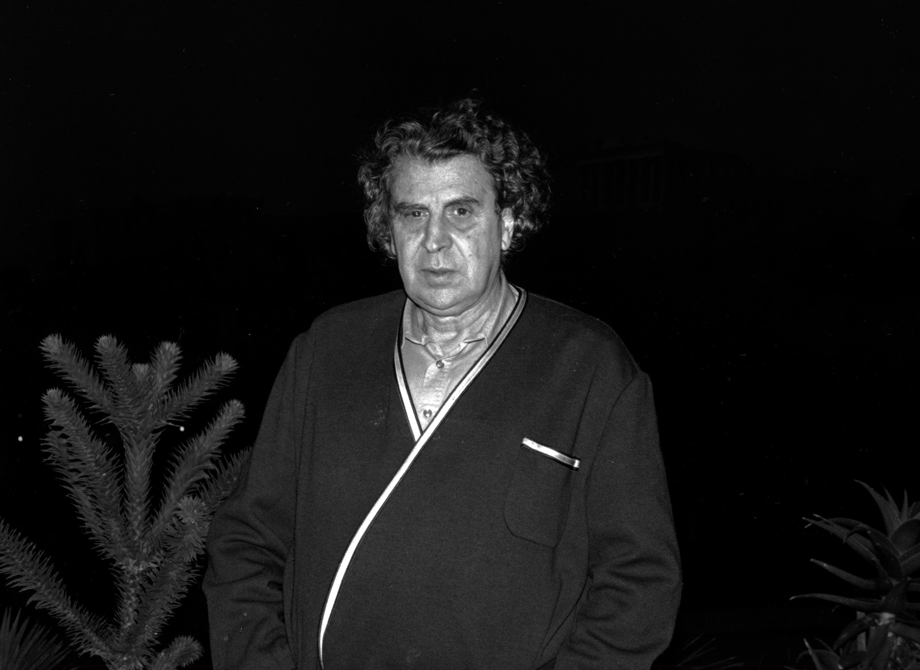 GREEK COMPOSER THEODORAKIS GIVES INTERVIEW TO REUTERS ON BALCONY ACROSS FROM ACROPOLIS IN ATHENS.