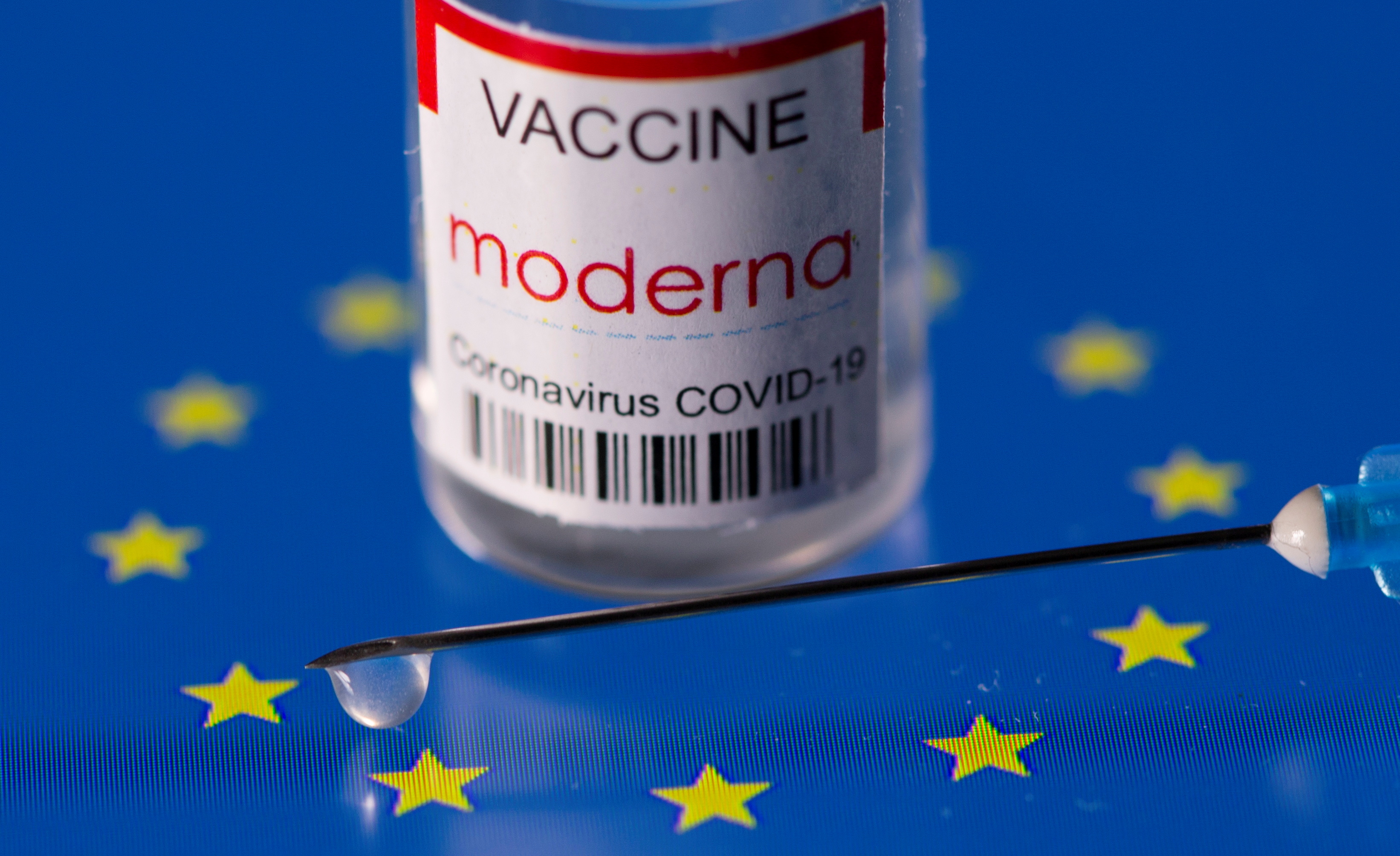 Vial labelled "Moderna coronavirus disease (COVID-19) vaccine" placed on displayed EU flag is seen in this illustration picture