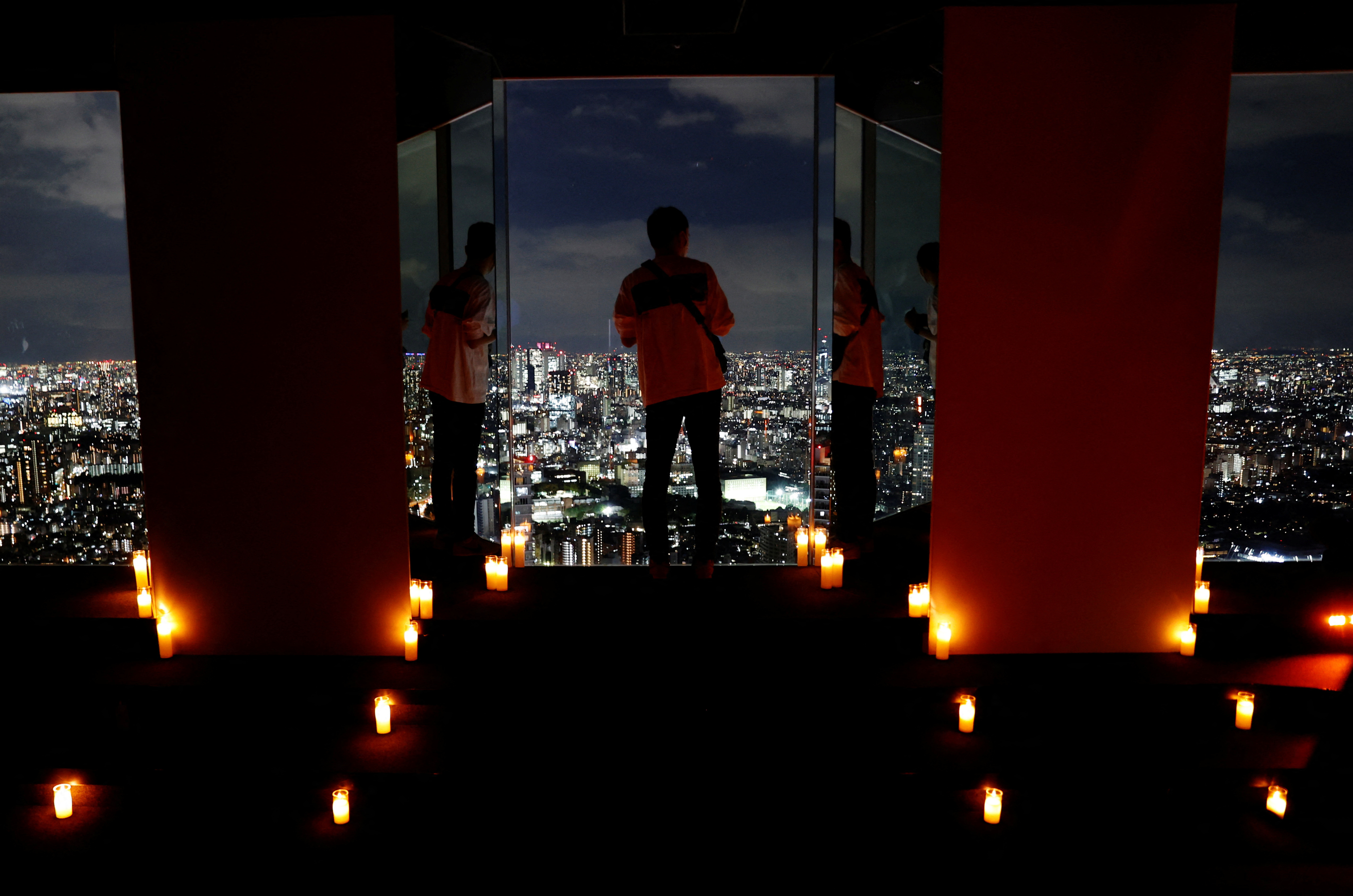 Visitors take photos with Tokyo's night view during 
